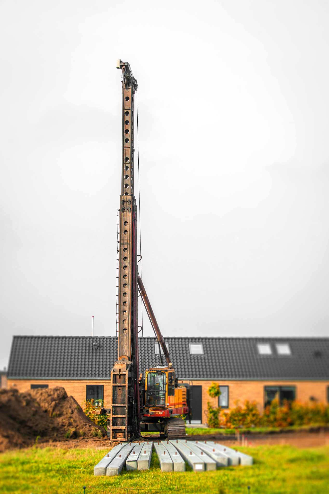 Sony 75-300mm F4.5-5.6 sample photo. Piling machine in a single family neighborhood photography