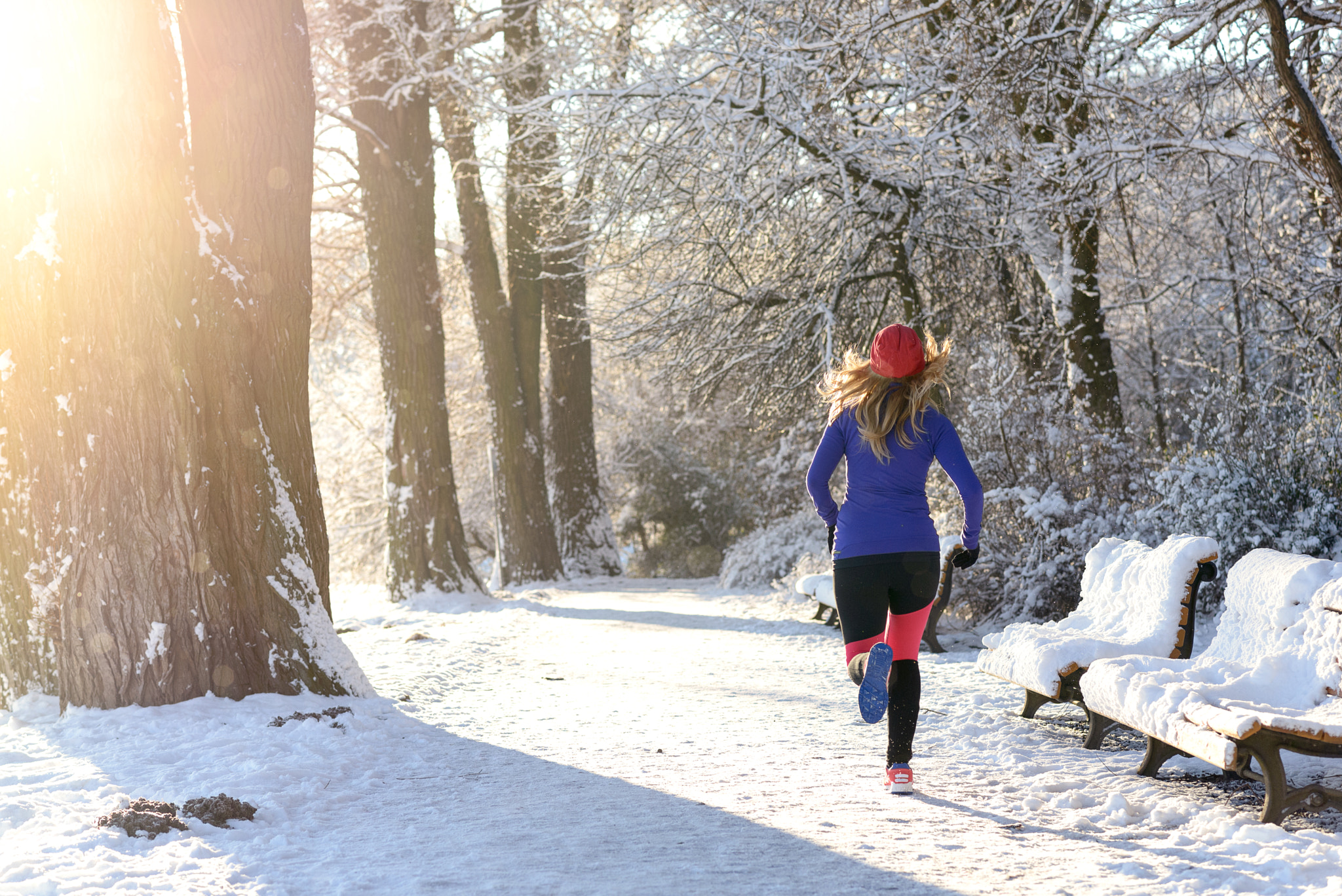 Young woman jogging in winter