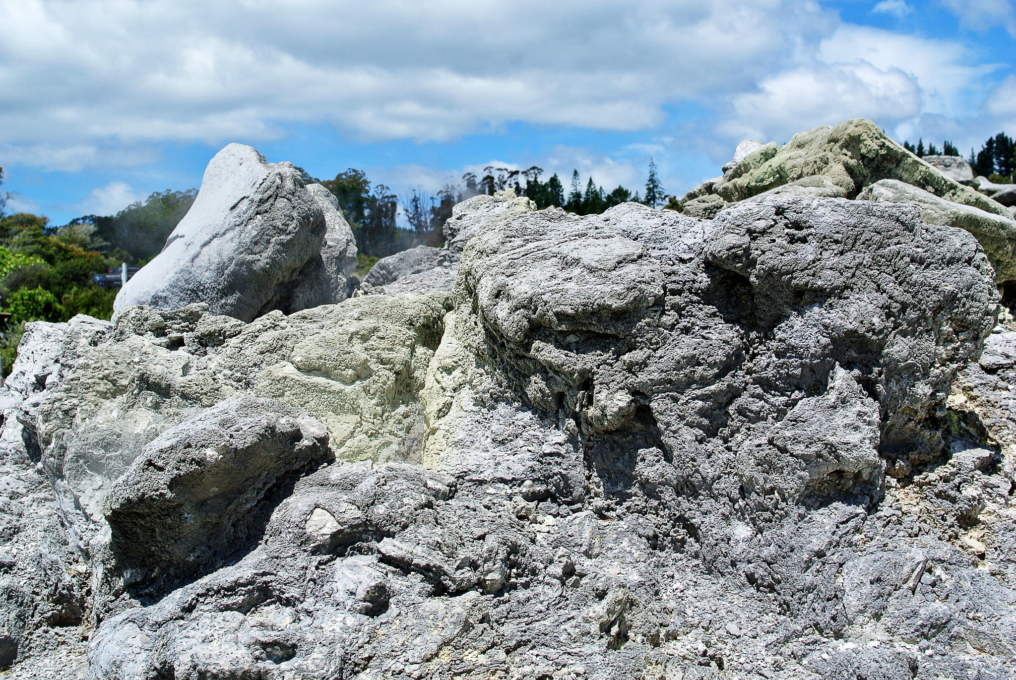Nikon 1 V1 + Nikon 1 Nikkor 18.5mm F1.8 sample photo. Rotorua geyser - new zealand - sulfure stones photography