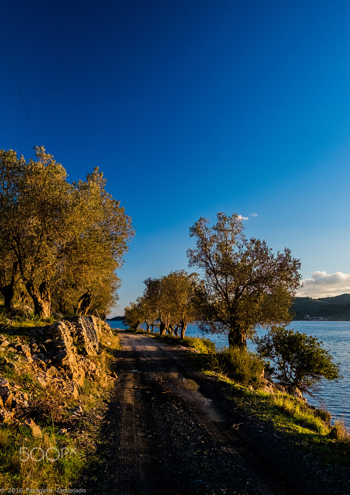 Fujifilm X-E2 + Fujifilm XF 16mm F1.4 R WR sample photo. Sunset on an empty dirt road photography