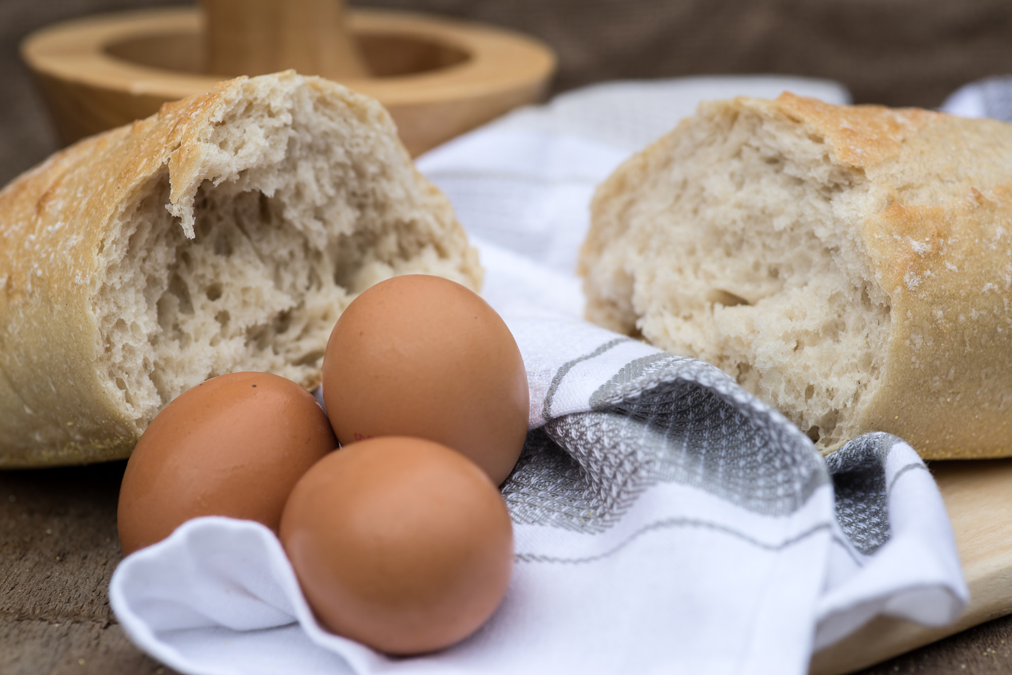 Nikon D600 + Sigma 105mm F2.8 EX DG Macro sample photo. Loaf of sourdough bread in rustic kitchend setting photography