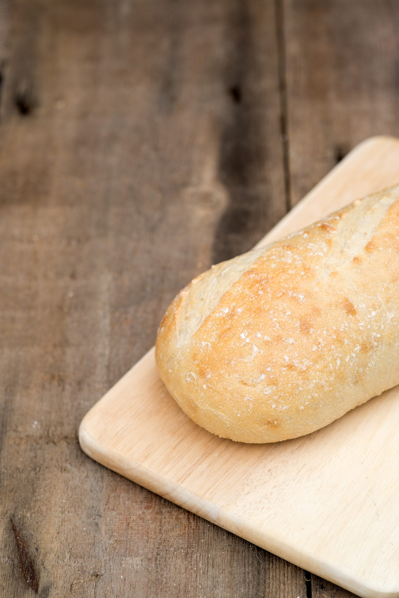 Nikon D600 + Sigma 105mm F2.8 EX DG Macro sample photo. Loaf of sourdough bread in rustic kitchend setting photography