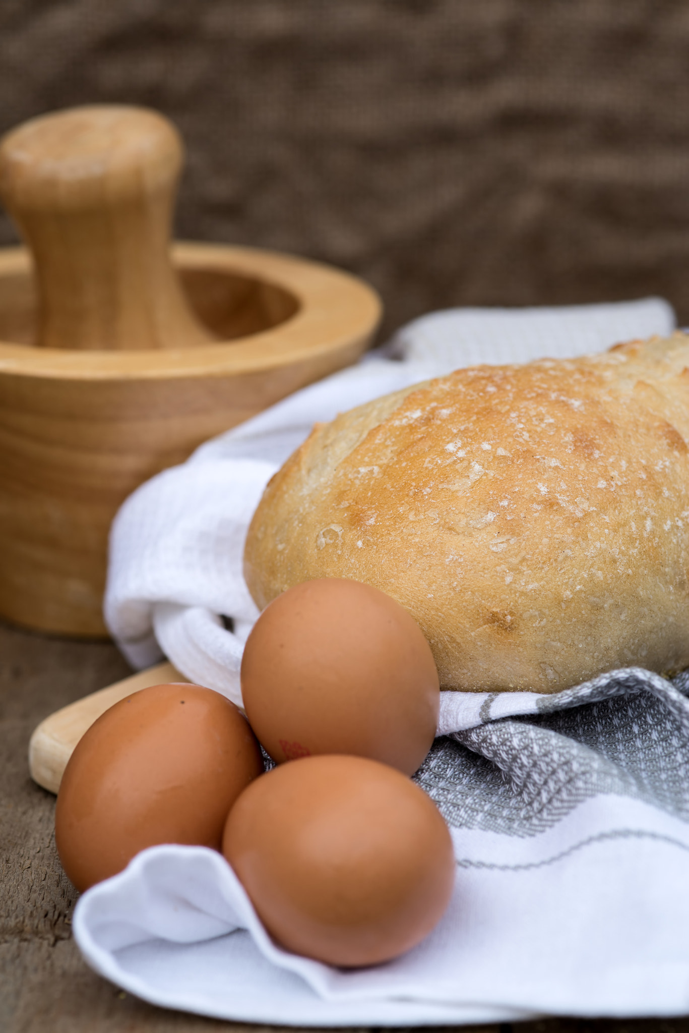 Nikon D600 + Sigma 105mm F2.8 EX DG Macro sample photo. Loaf of sourdough bread in rustic kitchend setting photography