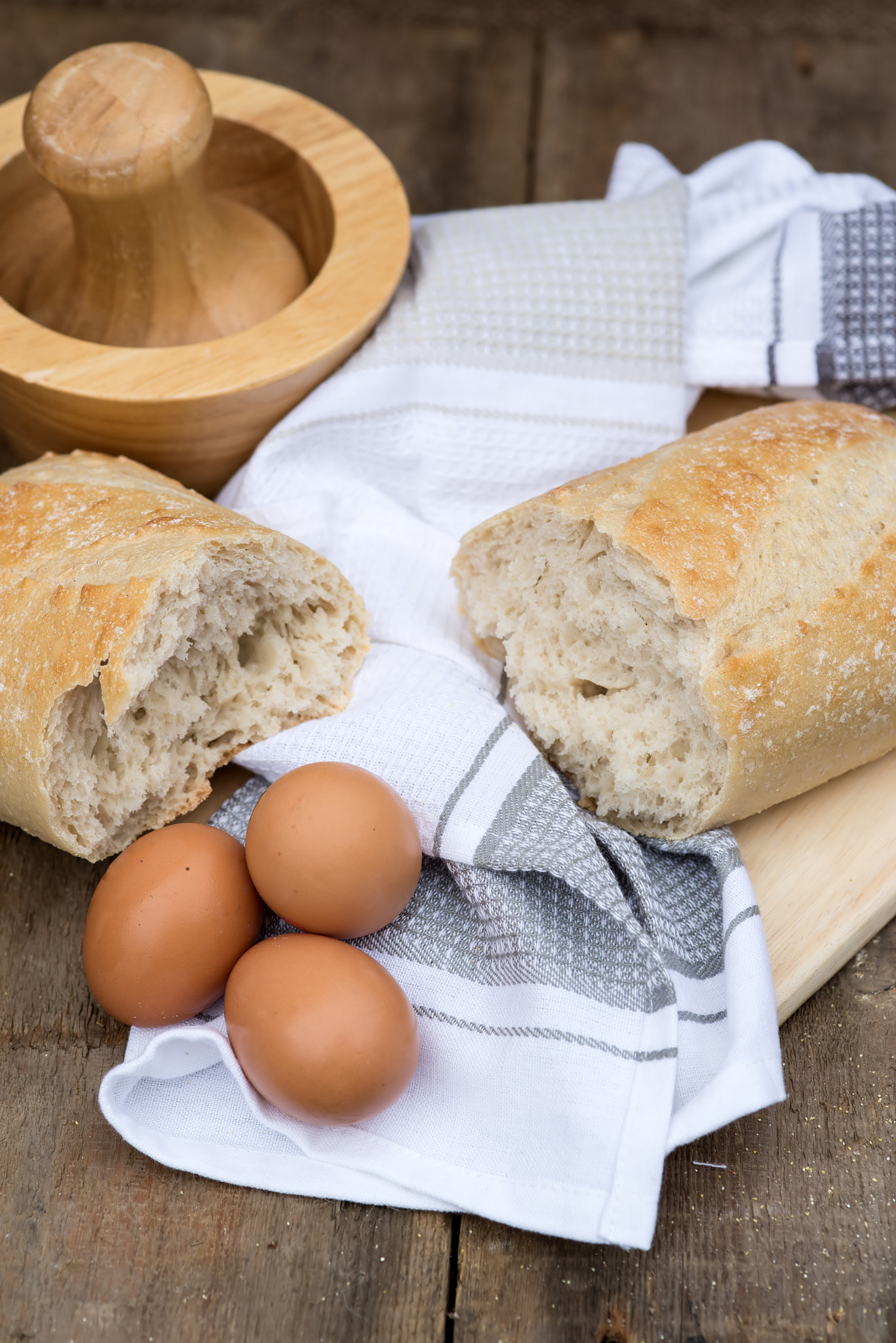Sigma 105mm F2.8 EX DG Macro sample photo. Loaf of sourdough bread in rustic kitchend setting photography
