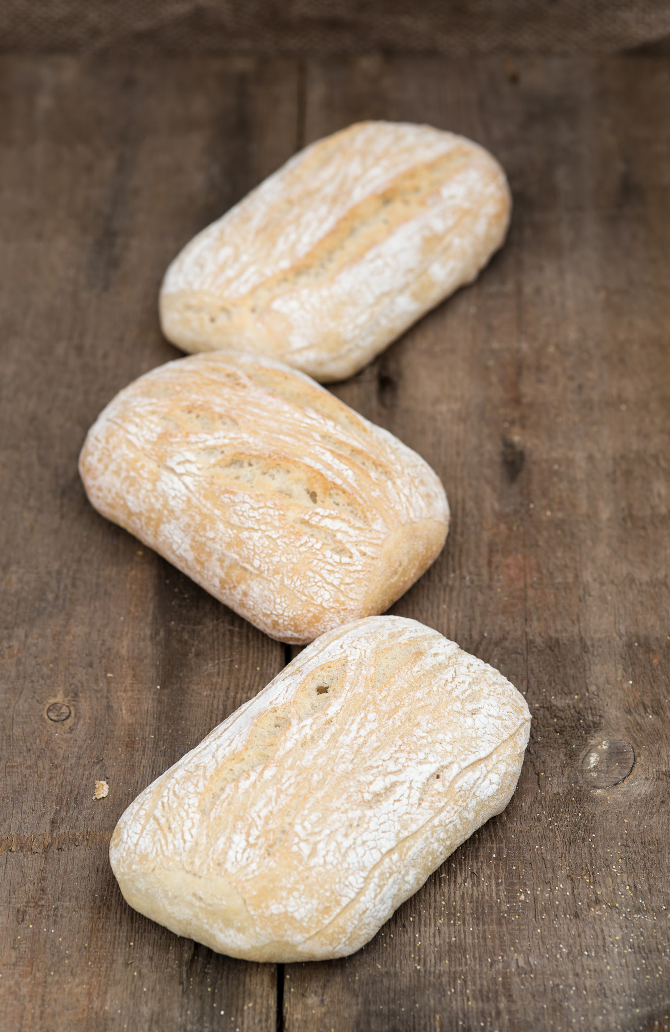 Nikon D600 + Sigma 105mm F2.8 EX DG Macro sample photo. Panini rolls in rustic kitchen setting with cooking utensils photography