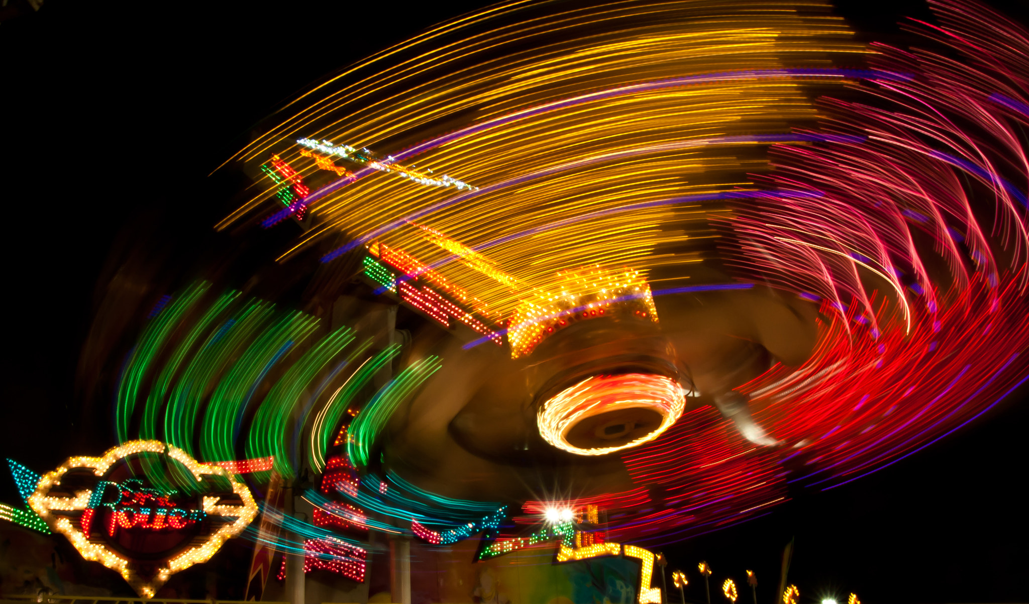 Canon EOS 40D + Sigma 18-50mm f/2.8 Macro sample photo. Merry go round photography