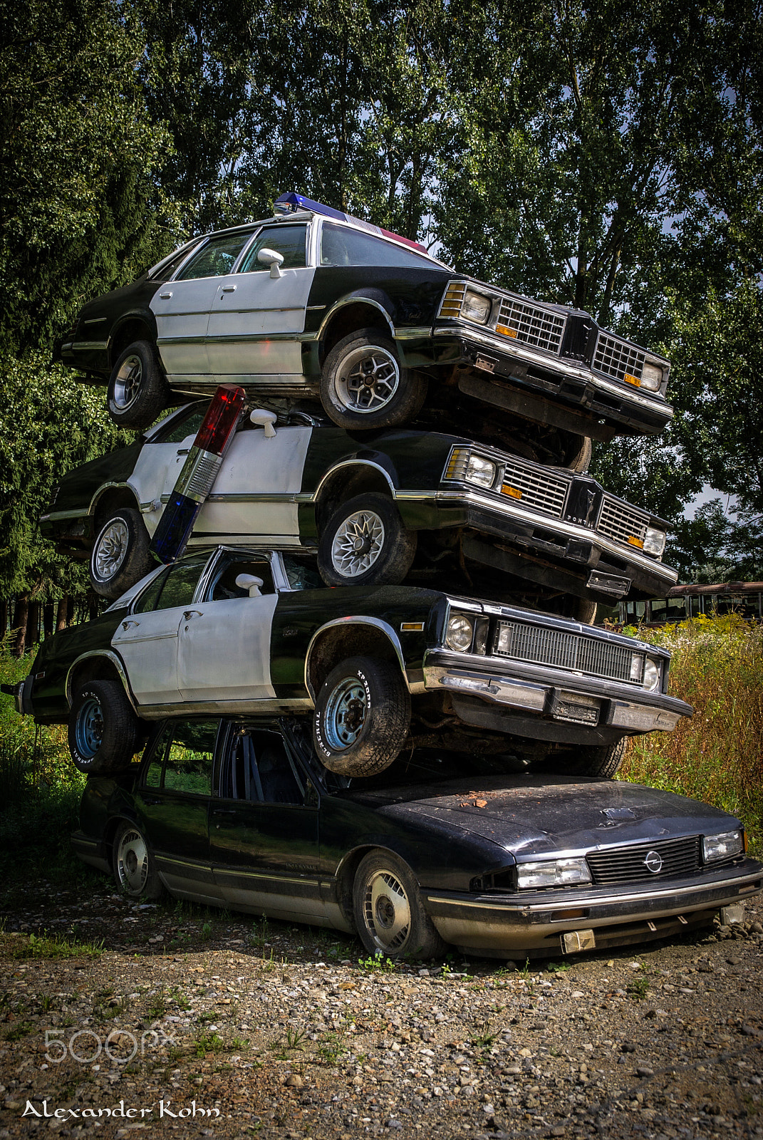 Sony Alpha DSLR-A100 sample photo. Pile of police cars photography