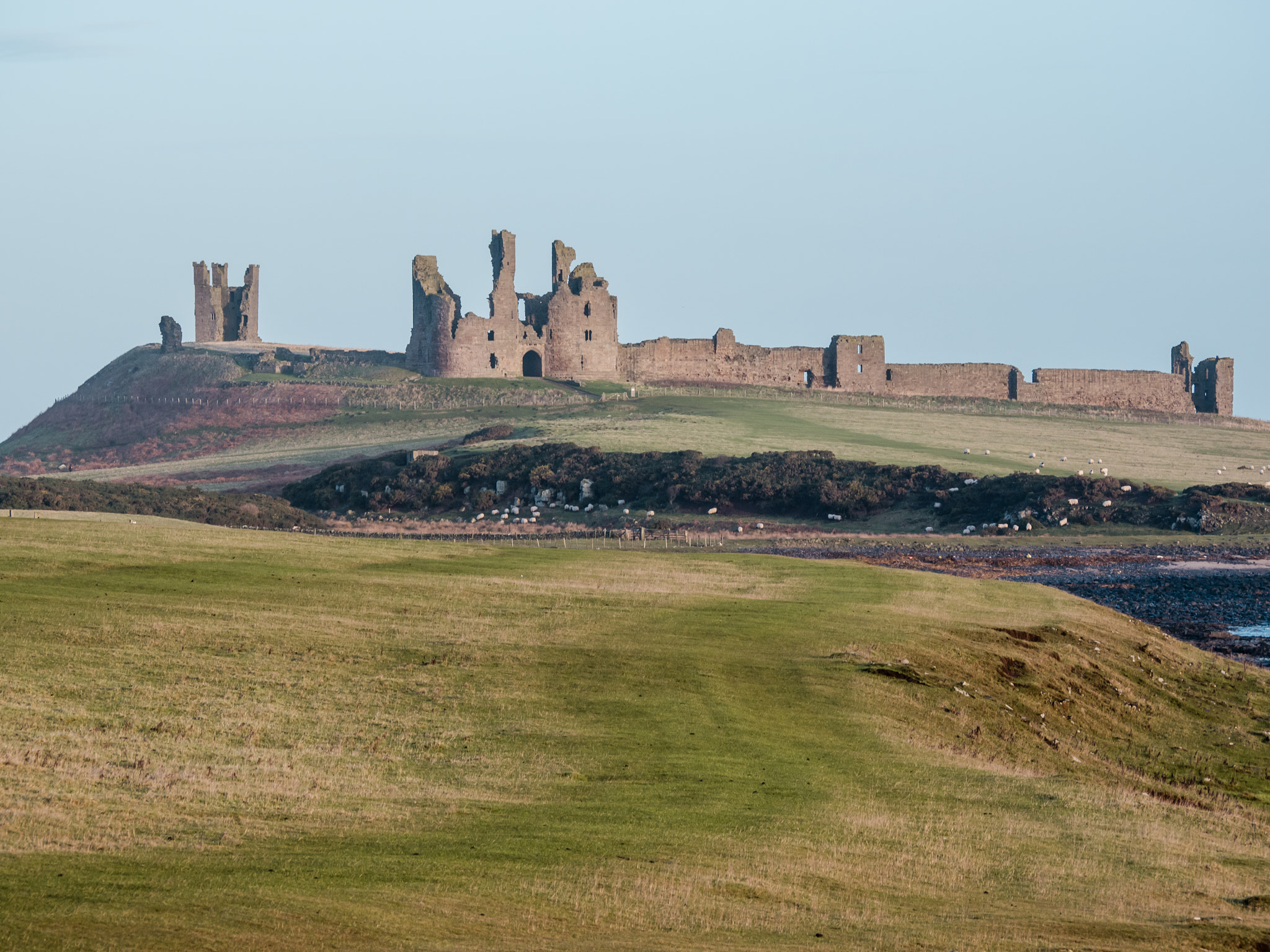 Panasonic Lumix G Vario 45-200mm F4-5.6 OIS sample photo. Dunstanburgh castle photography