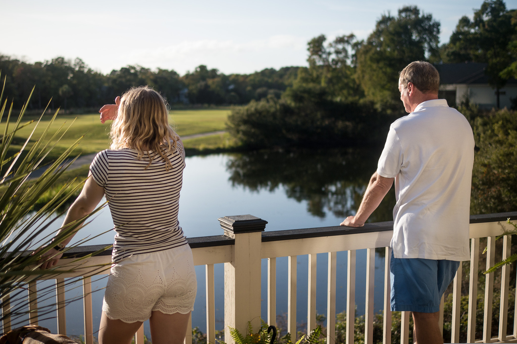 Panasonic Lumix DMC-G6 + Panasonic Leica DG Summilux 25mm F1.4 II ASPH sample photo. Father and daughter on balcony photography