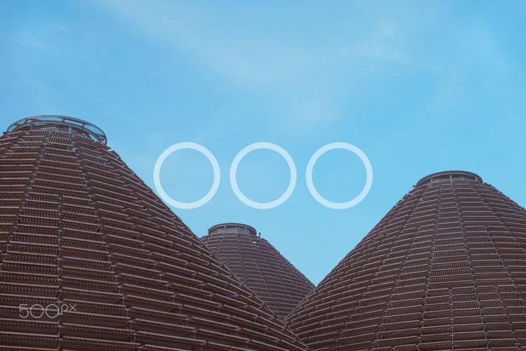 Sony a7S + Canon EF 35-80mm f/4-5.6 sample photo. Modern pyramids and blue sky photography