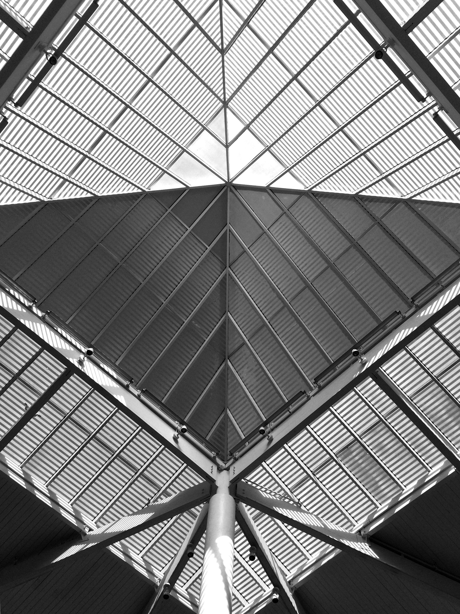 Curious Satellite Hueless on iPhone sample photo. A ceiling of a building mall photography