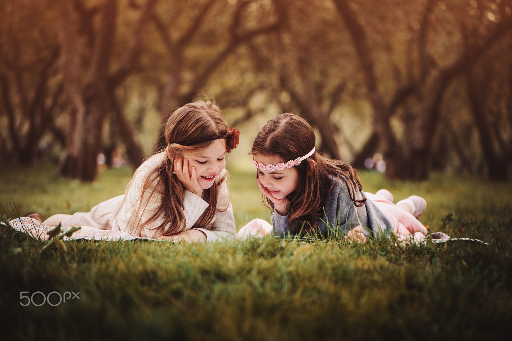 Happy girlfriends in summer forest