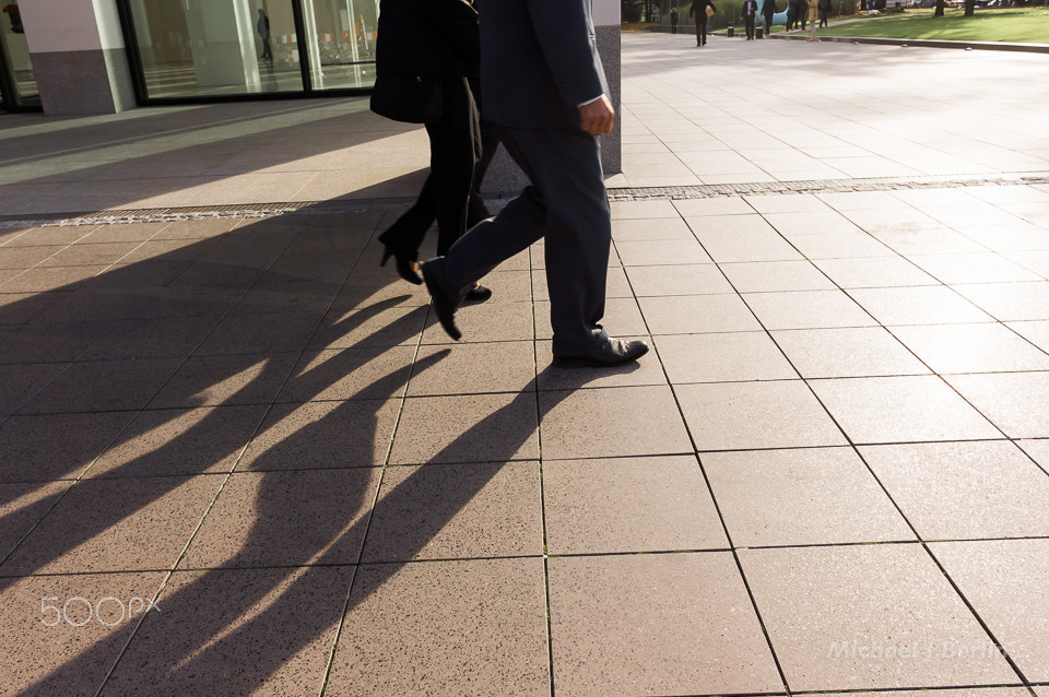 Sony Alpha NEX-5N + Sigma 19mm F2.8 EX DN sample photo. Anonymous crop of business people walking photography