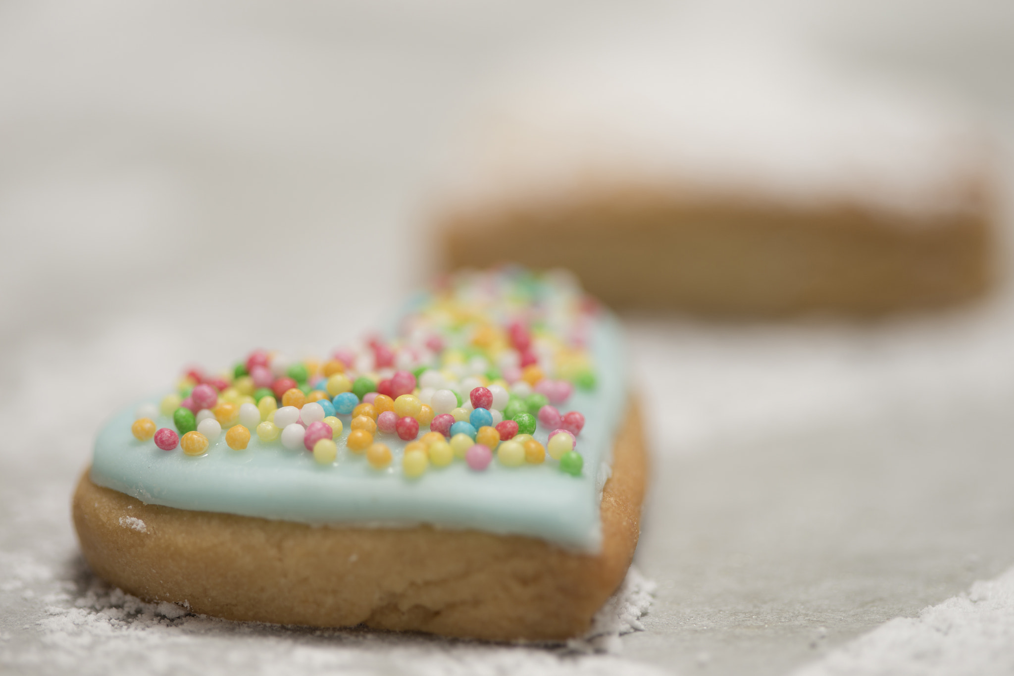 Canon EOS-1D X + Canon EF 100mm F2.8 Macro USM sample photo. Baked valentine's heart covered with blue icing and confetti photography