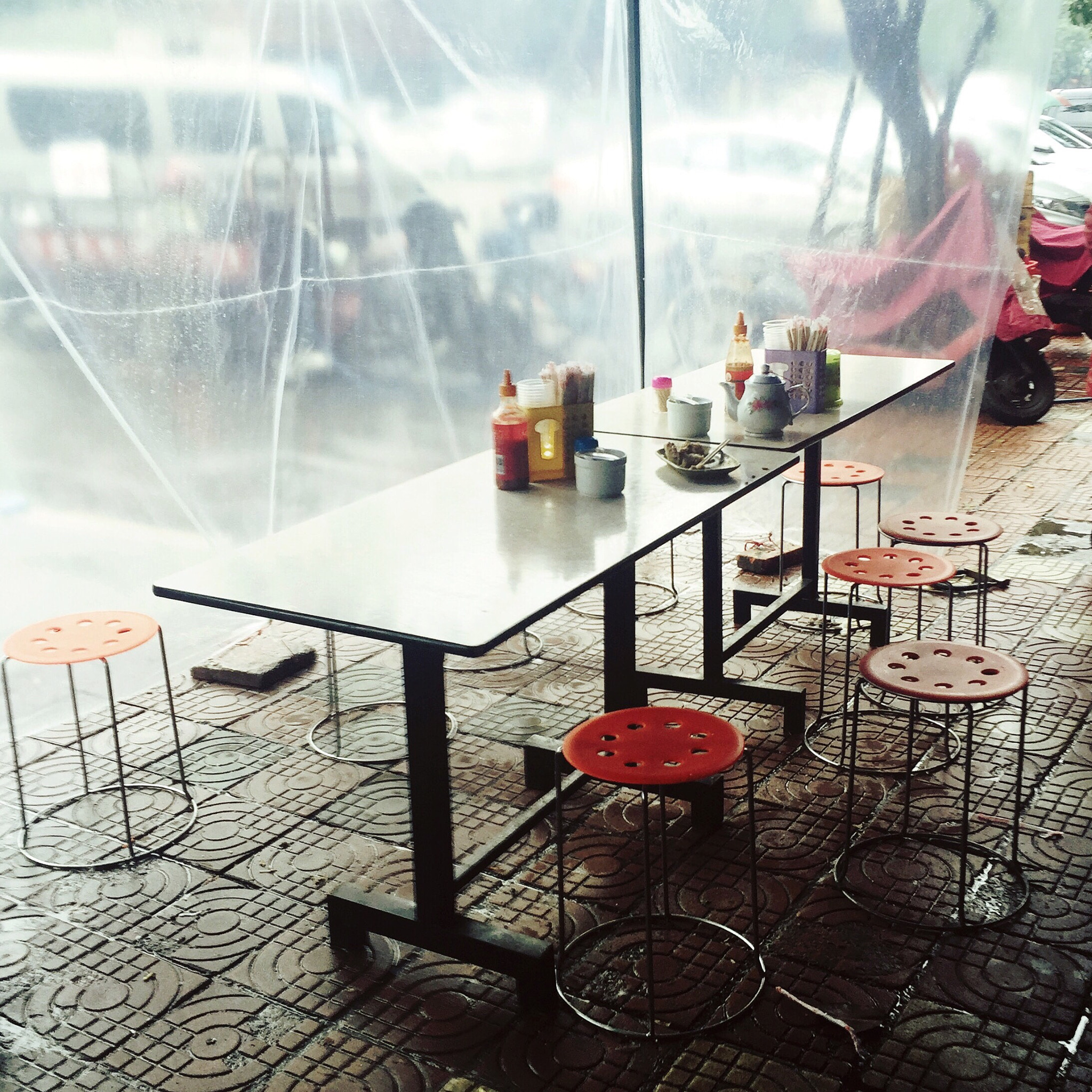 Hipstamatic 310 sample photo. A food court beside a street. it's cold n raining today. photography
