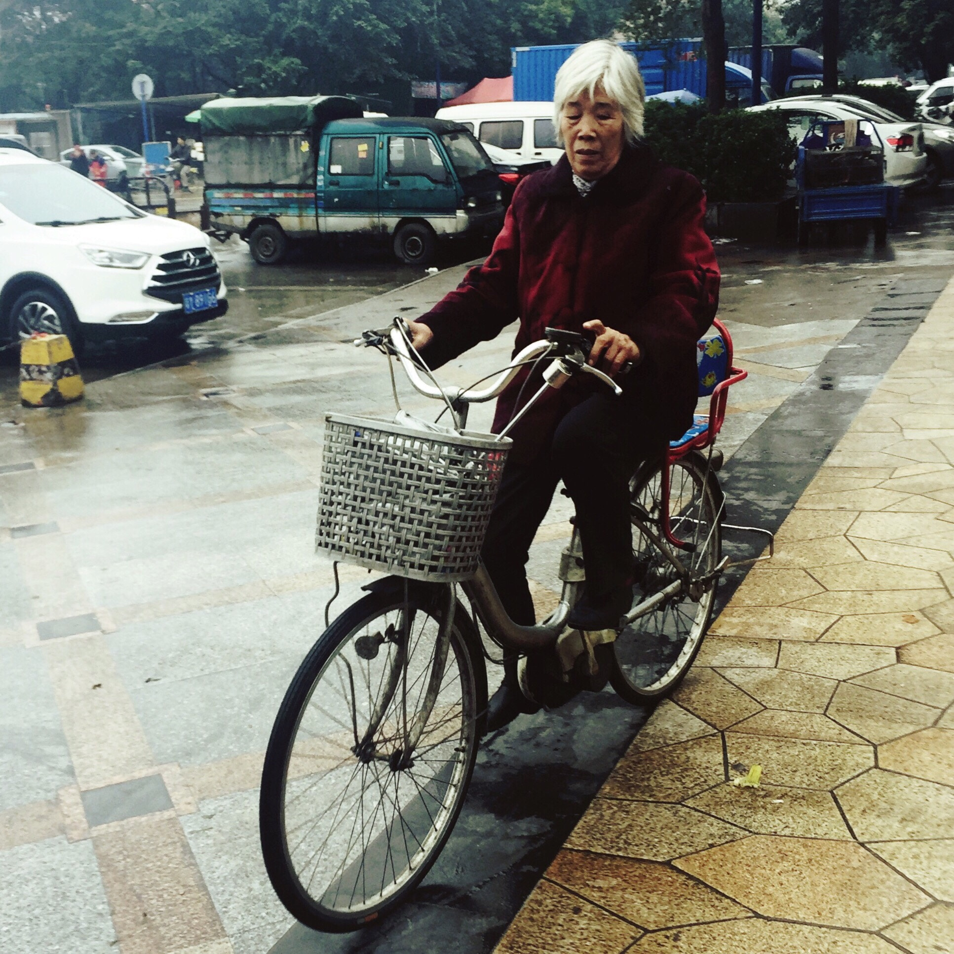 Hipstamatic 310 sample photo. A old lady with white hair riding a bicycle. photography