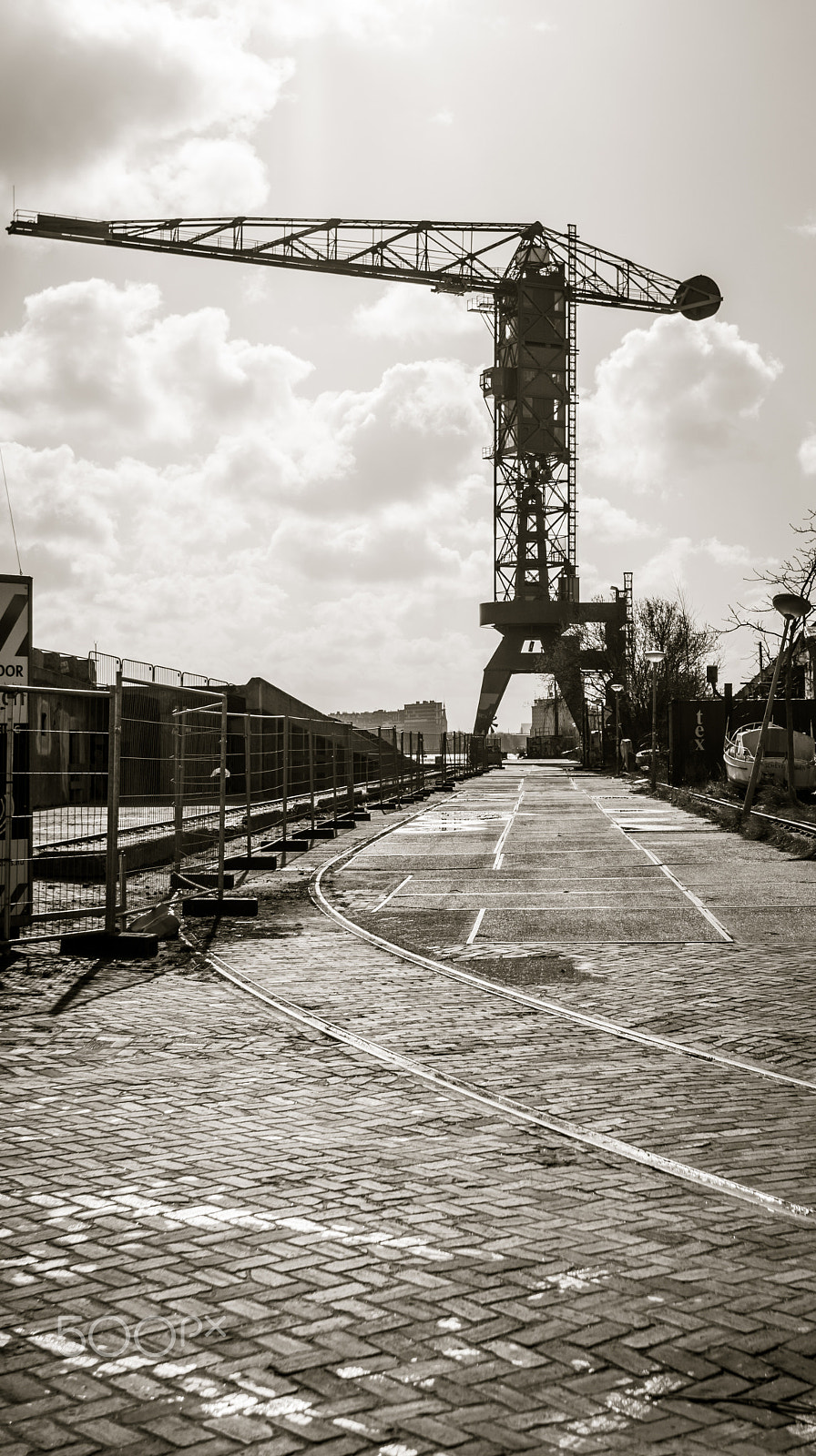 Sony Alpha NEX-7 + Sony 28mm F2.8 sample photo. Crane near the docks of amsterdam noord district photography