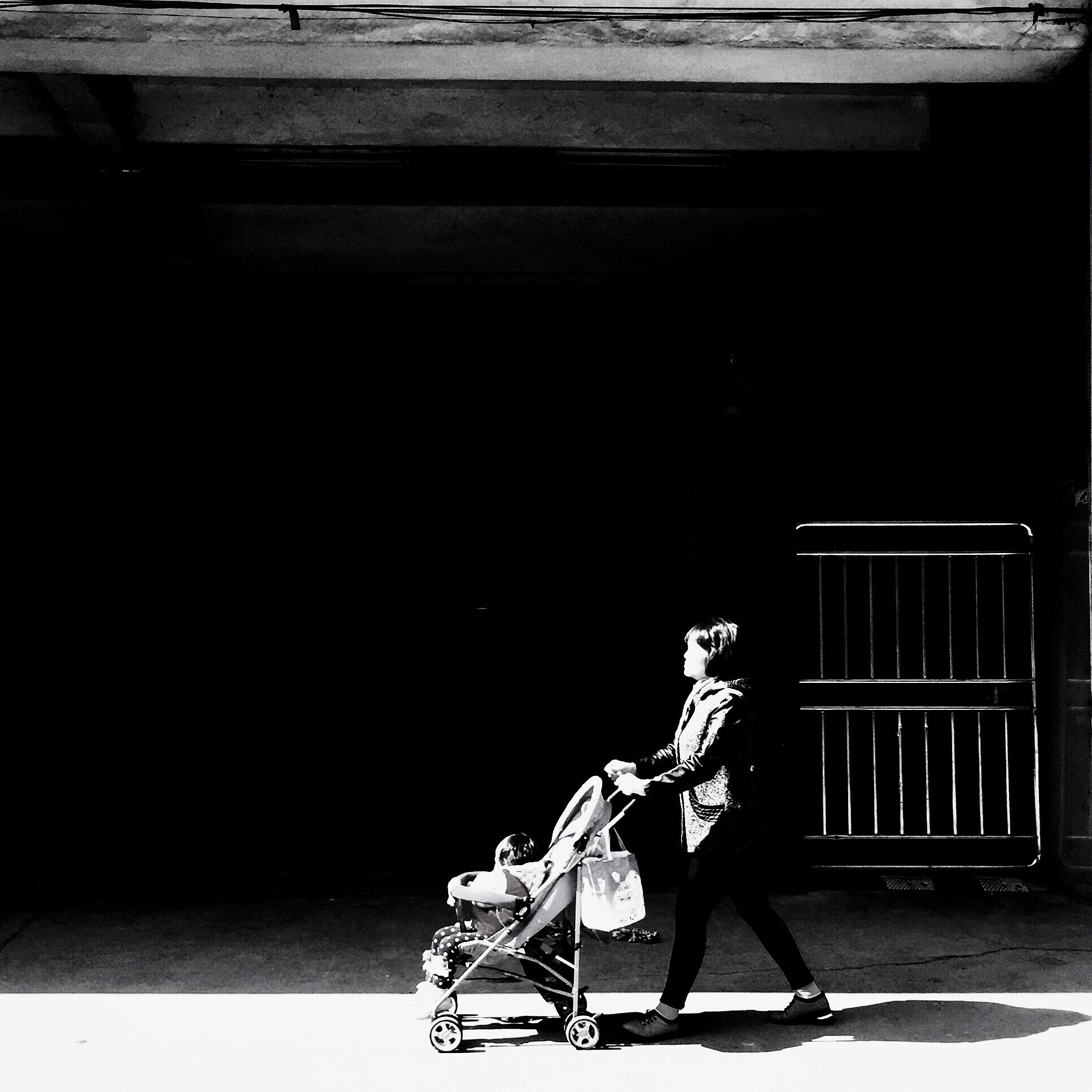 Hipstamatic 305 sample photo. A old lady walking by with a baby in trolley. it's day but with warm sunshine. photography