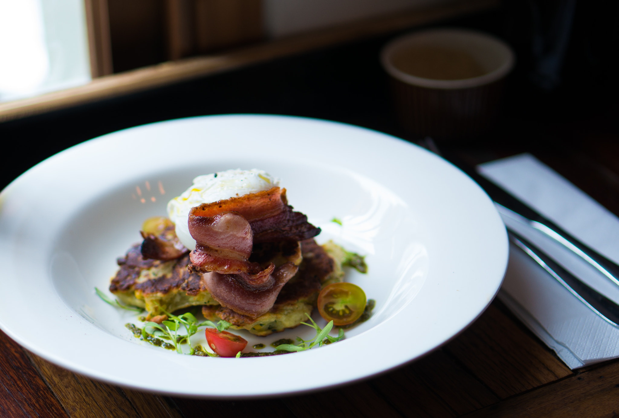 Sony Alpha NEX-5R + E 50mm F1.8 OSS sample photo. Corn fritters with bacon and poached egg photography