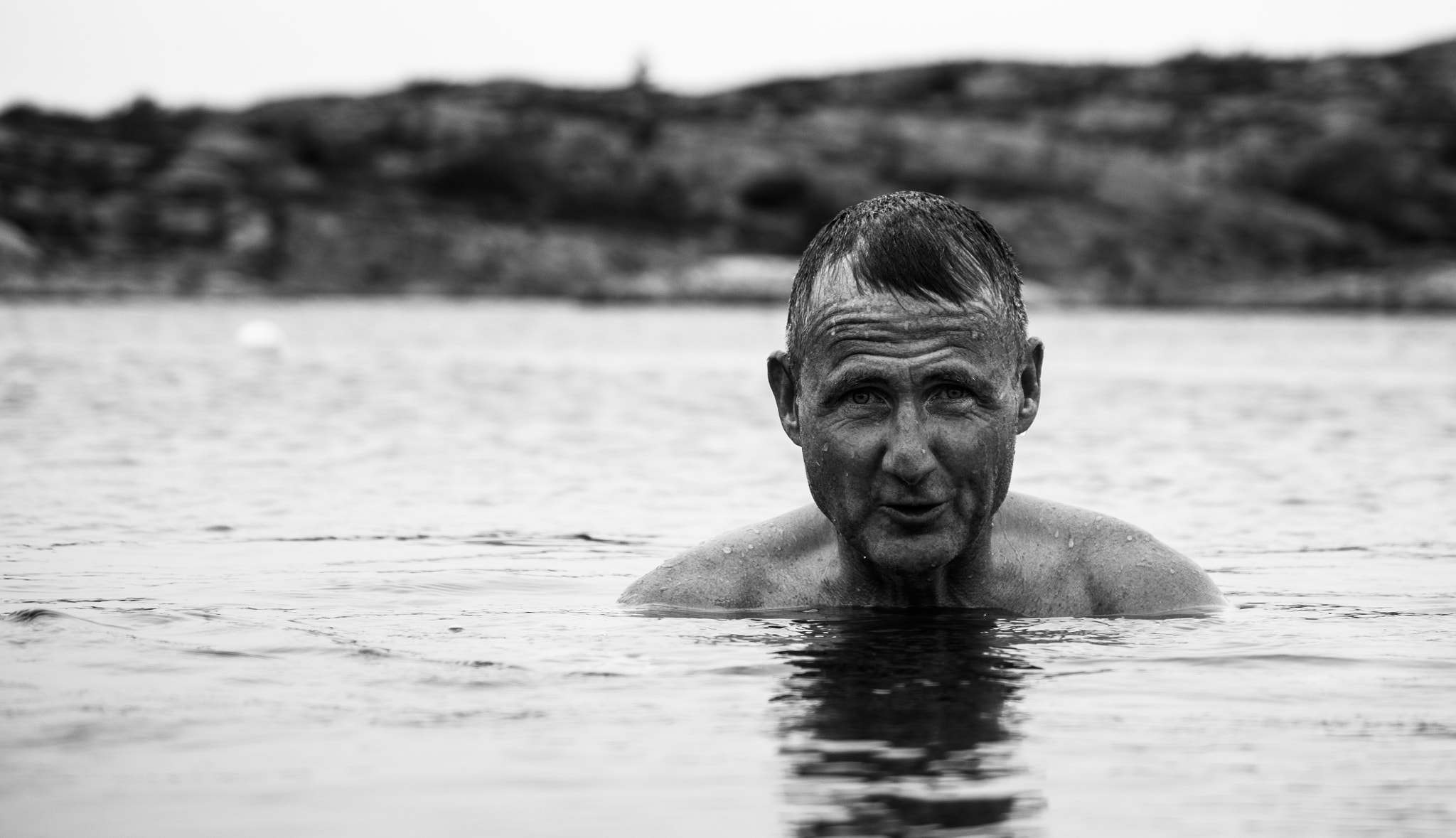 Pentax smc DA 50-200mm F4-5.6 ED WR sample photo. Man in water photography