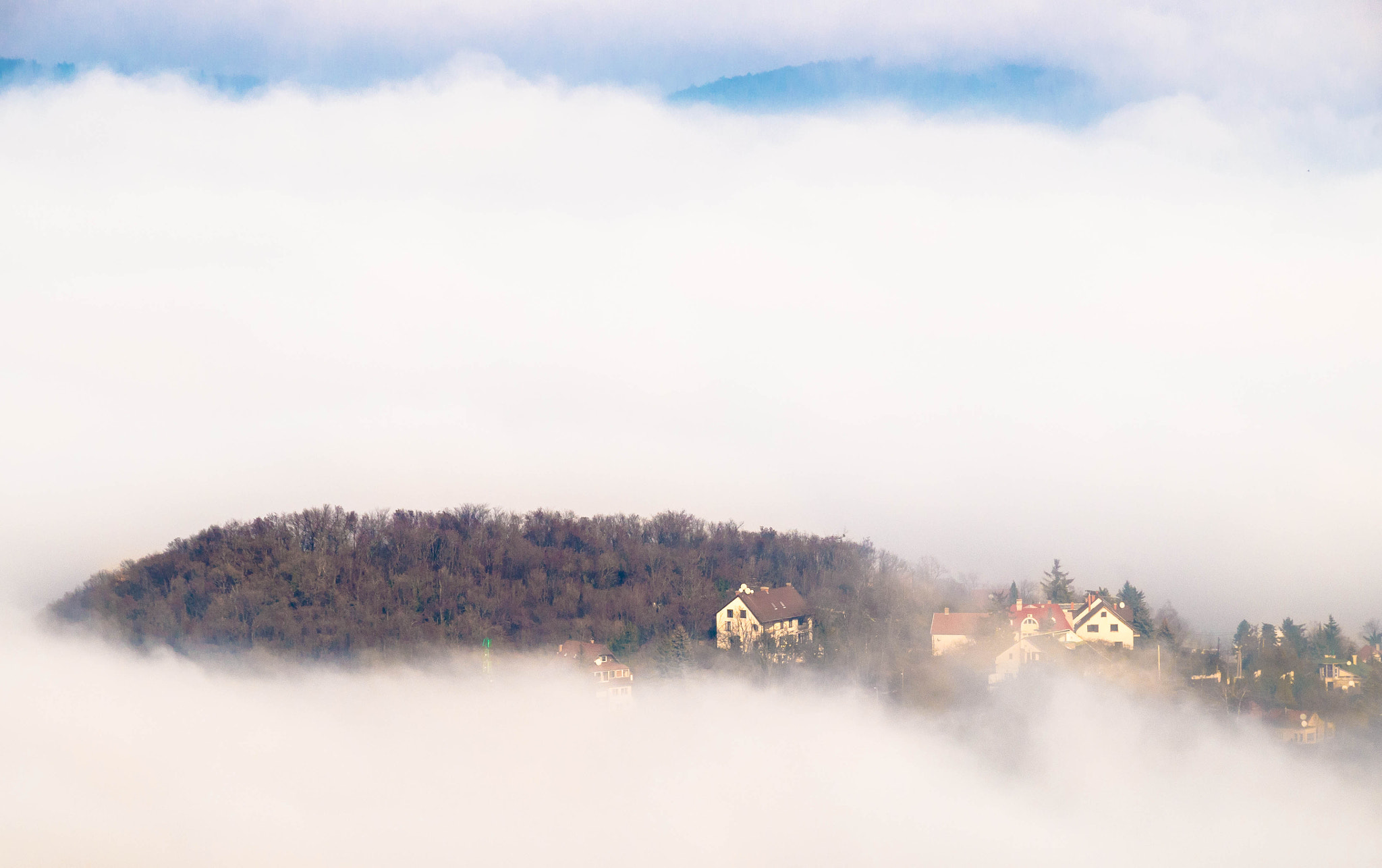 Sigma 18-200mm F3.5-6.3 II DC OS HSM sample photo. Houses in the sky photography