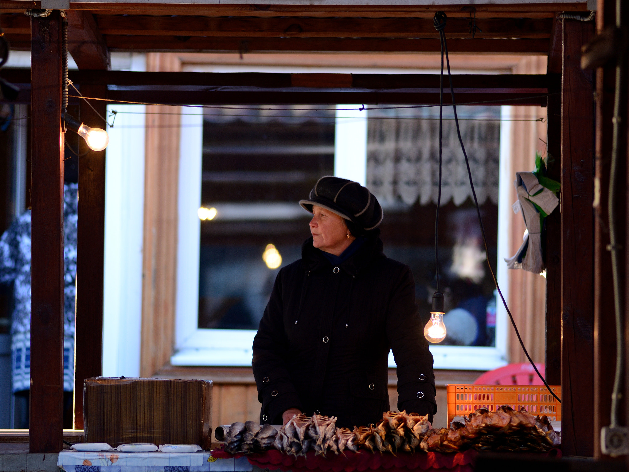 Nikon D600 + Nikon AF Nikkor 180mm F2.8D ED-IF sample photo. Fisher seller at market along lake baikal photography