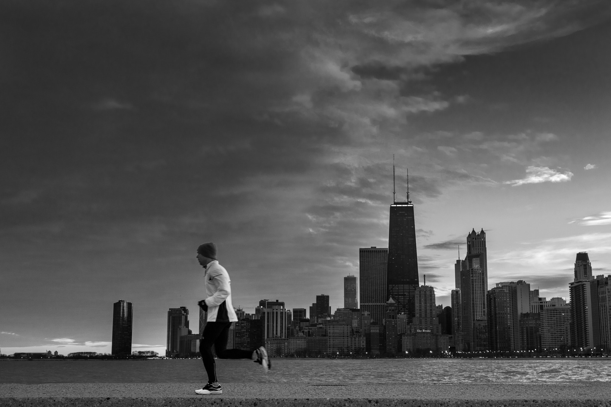 Canon EF 35mm F1.4L II USM sample photo. Sunset, jogger, chicago. photography