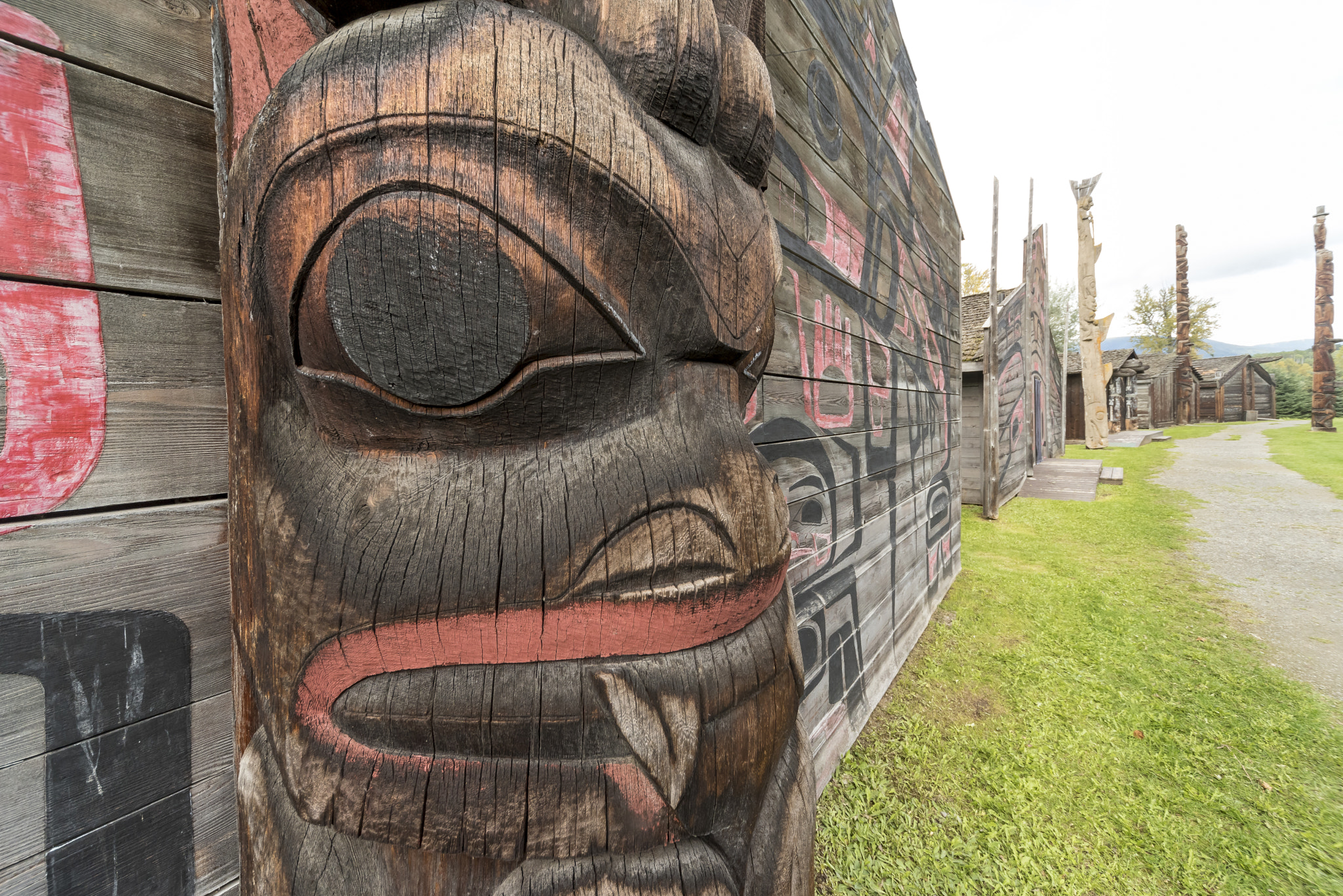 Sigma 12-24mm F4.5-5.6 EX DG Aspherical HSM sample photo. Bear figure on totem pole on lodge in ksan first nations village in hazelton bc photography
