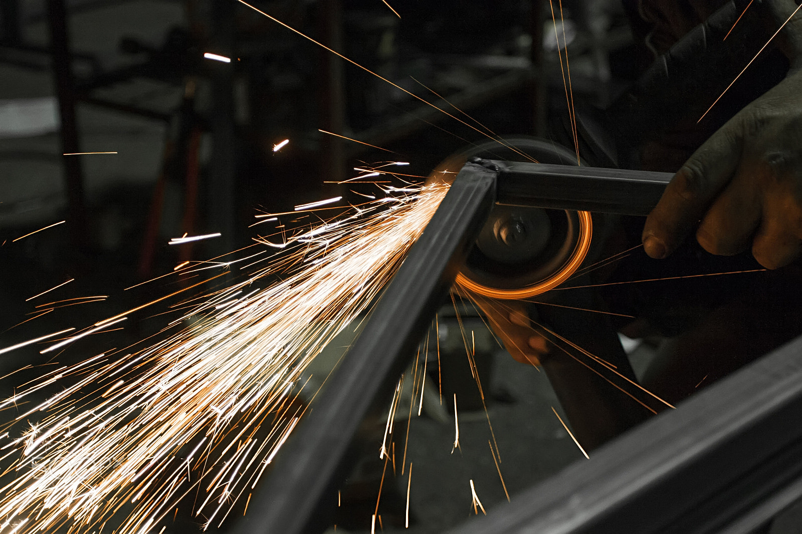 Canon EOS 30D + Canon EF 17-40mm F4L USM sample photo. Sparks while grinding iron photography