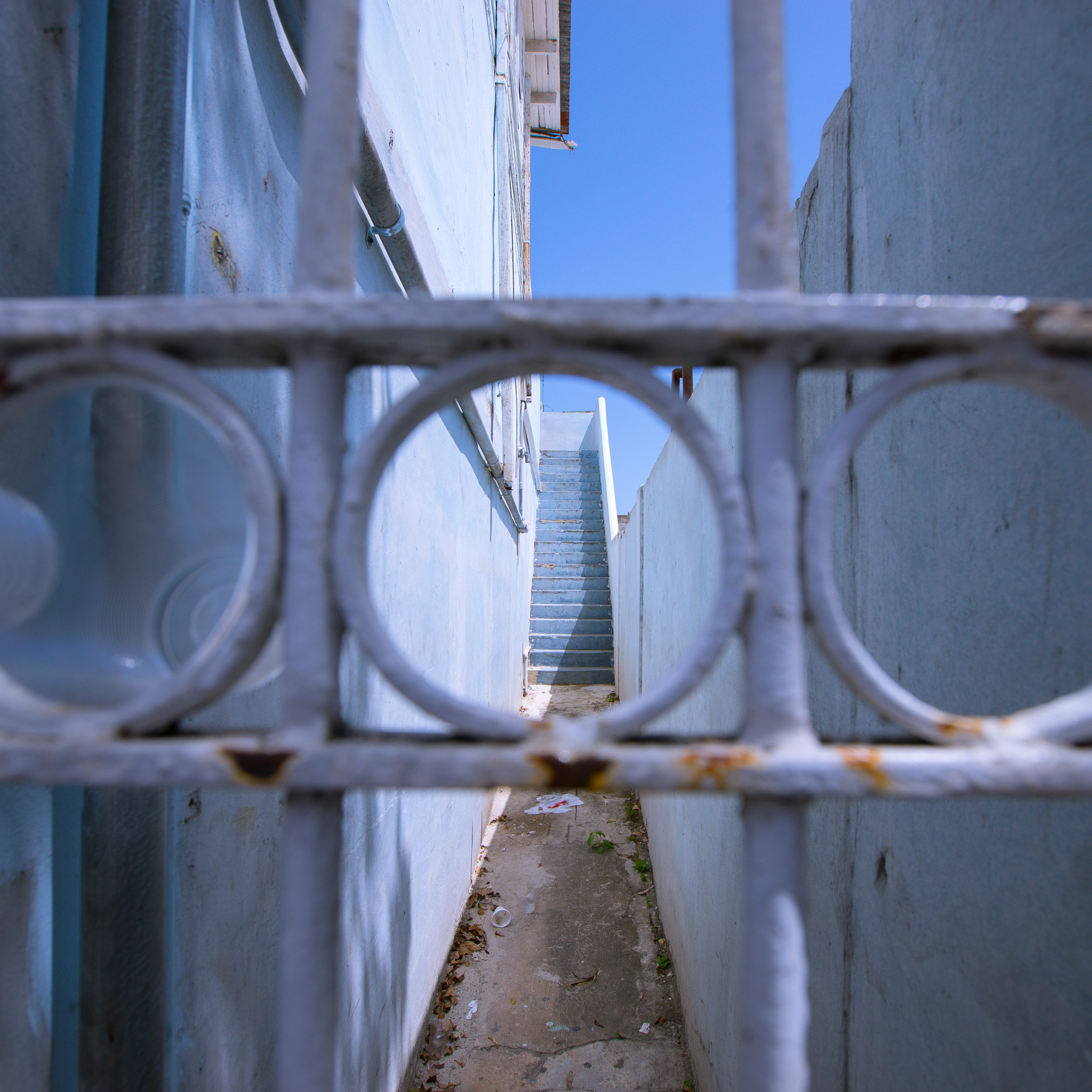 Sony a7 + Canon EF 16-35mm F2.8L II USM sample photo. Peering through a gate in puerto rico photography
