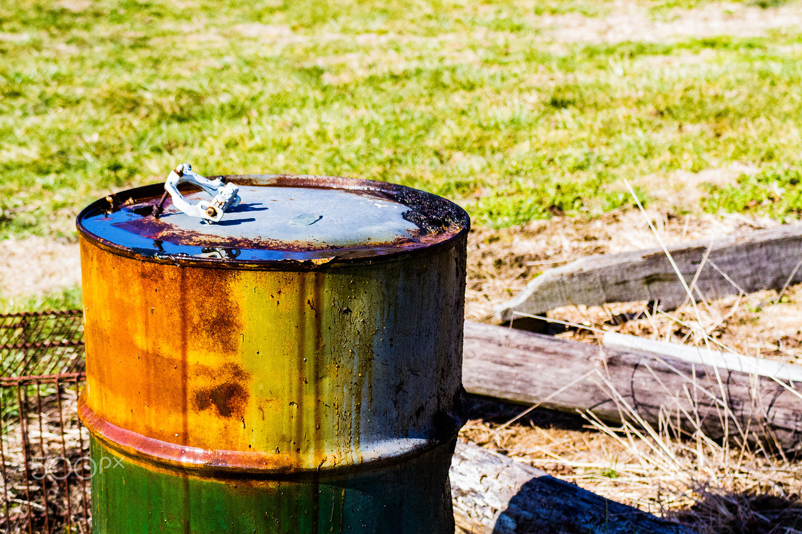Canon EF 28-90mm f/4-5.6 sample photo. Leaky oil drum photography