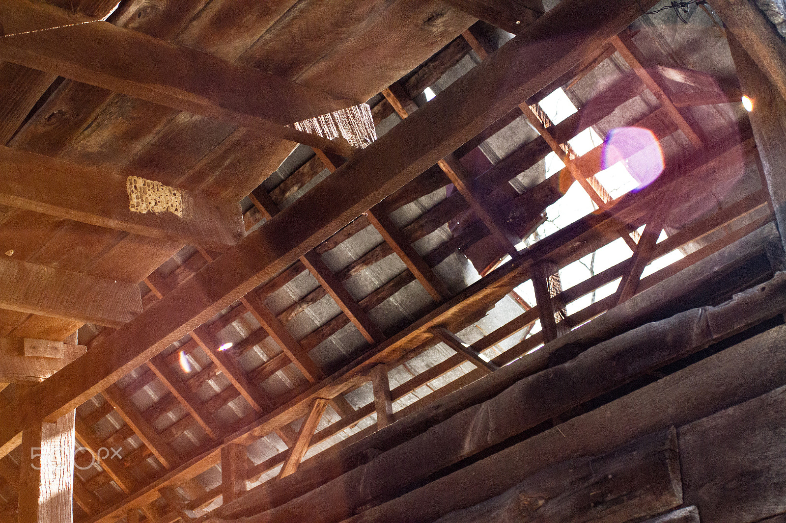 Canon EF 28-90mm f/4-5.6 sample photo. Light breaking through damaged barn roof photography