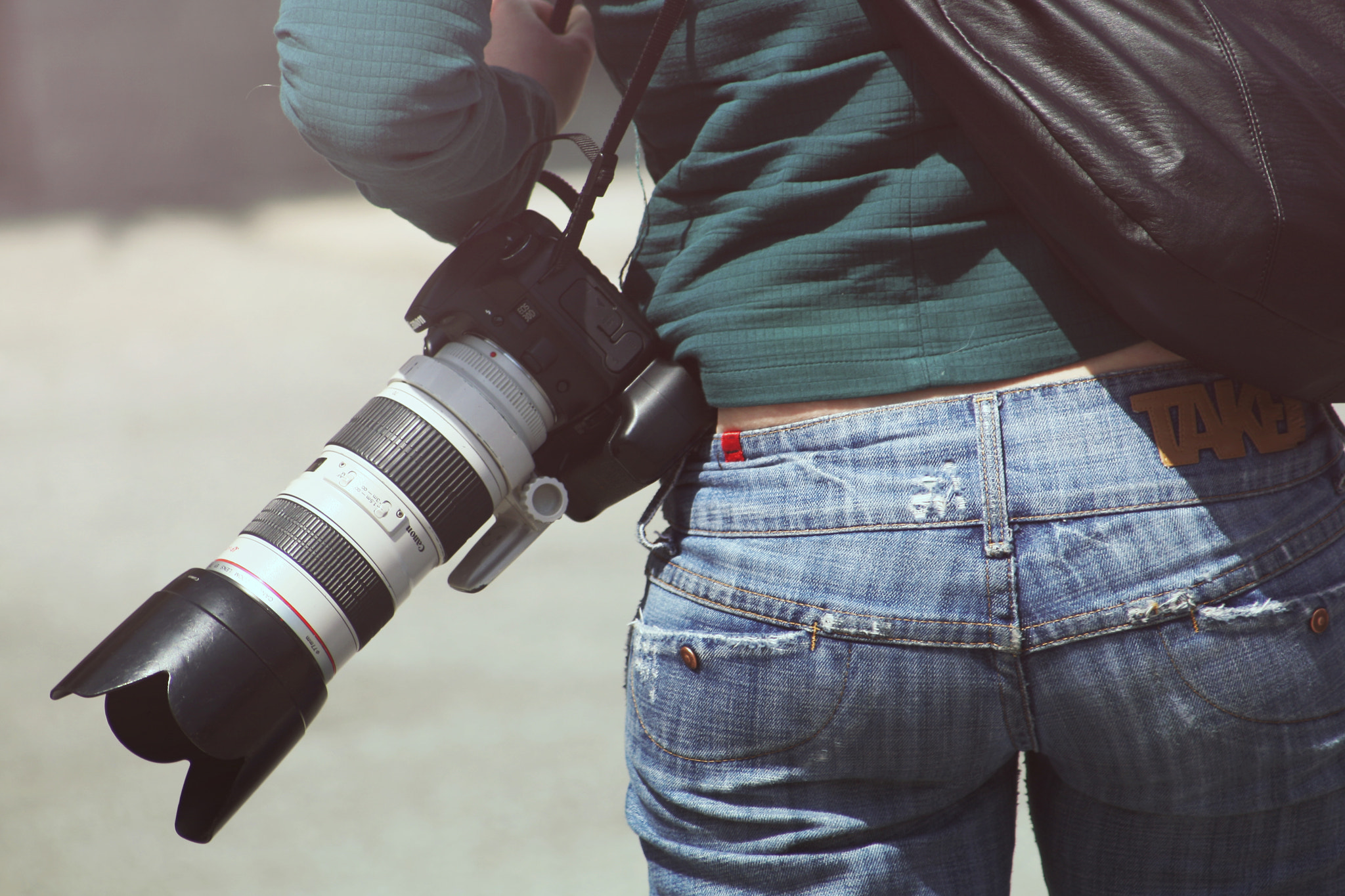 Canon EF 55-200mm F4.5-5.6 II USM sample photo. Person woman camera photographer photography