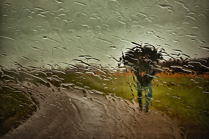 Sony E 18-200mm F3.5-6.3 OSS sample photo. Walking in the rain with ambrella photography
