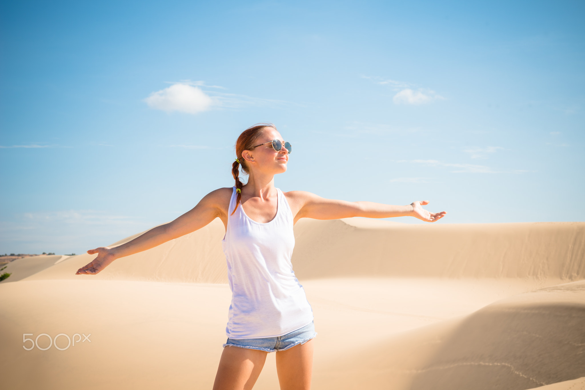 Beautiful woman in sand dunes