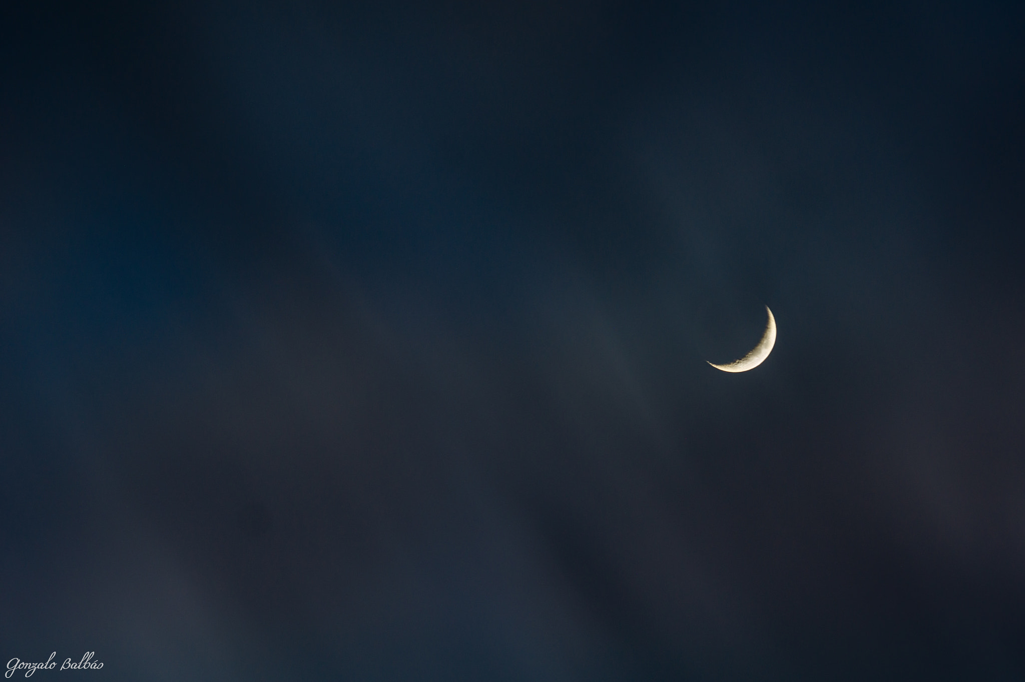 Sony SLT-A33 + Tamron SP 70-200mm F2.8 Di VC USD sample photo. Clouds through quarter moon photography