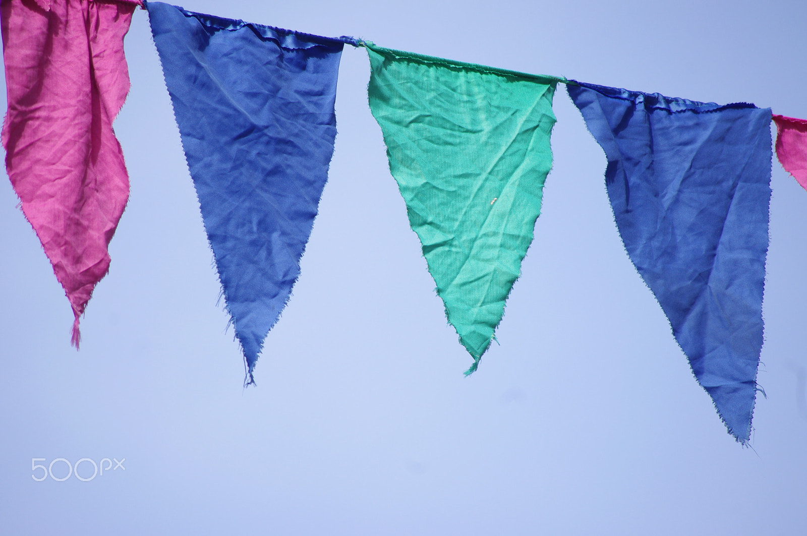 Pentax smc DA 55-300mm F4.0-5.8 ED sample photo. Colorful pennants blue sky photography