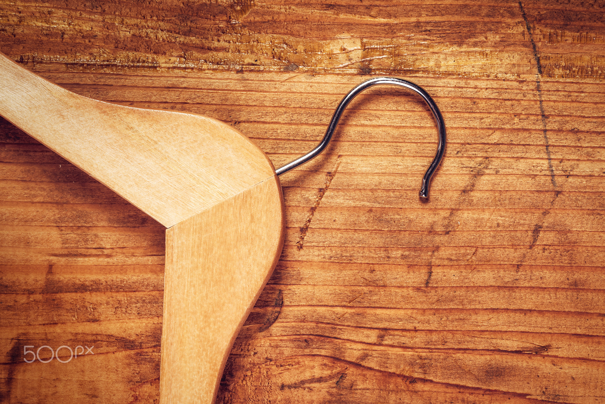 Retro cloth hanger on rustic wooden background, top view