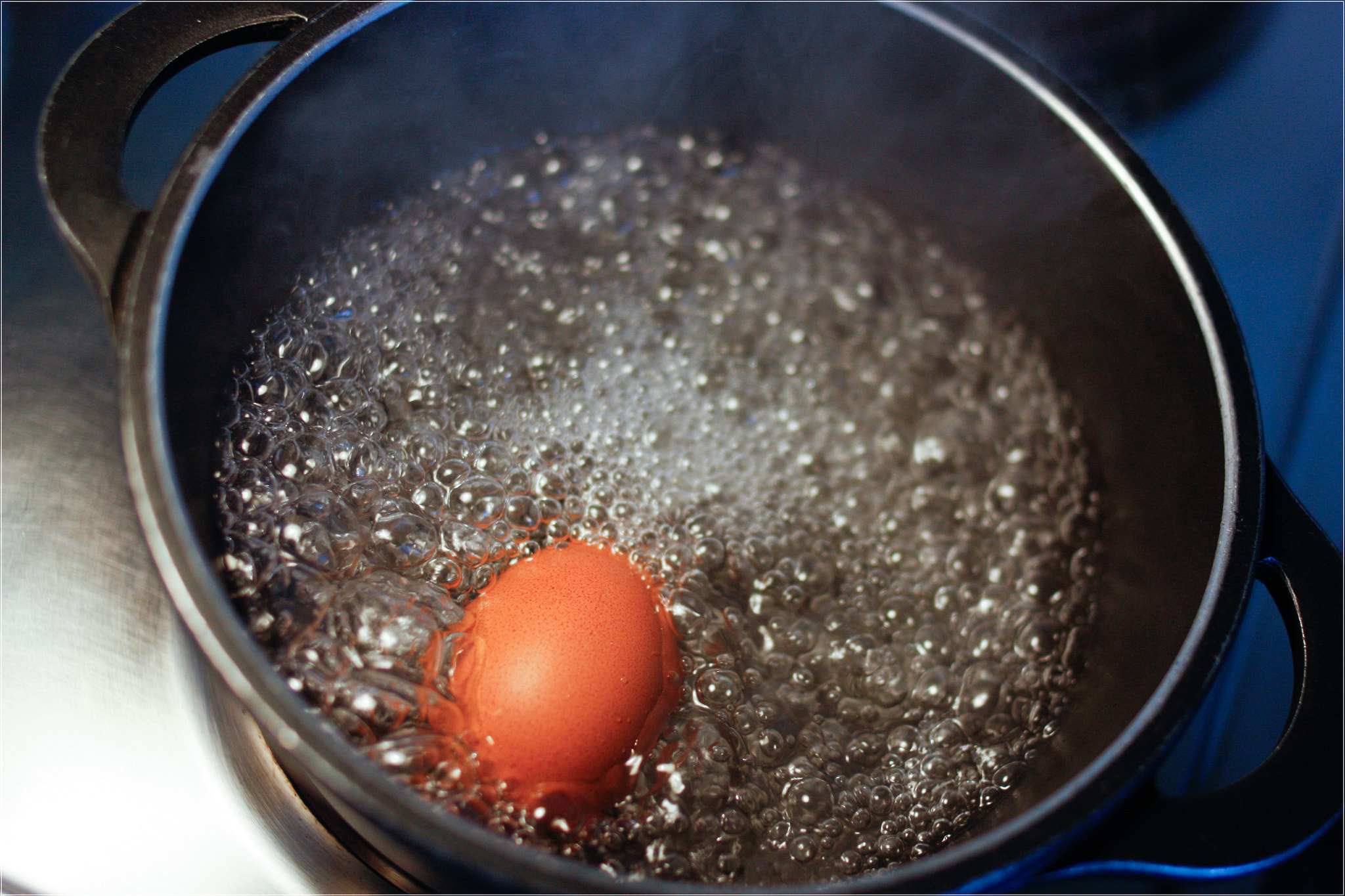 Canon EOS 450D (EOS Rebel XSi / EOS Kiss X2) + Canon EF 35mm F2 sample photo. Egg boiling in a pot. photography