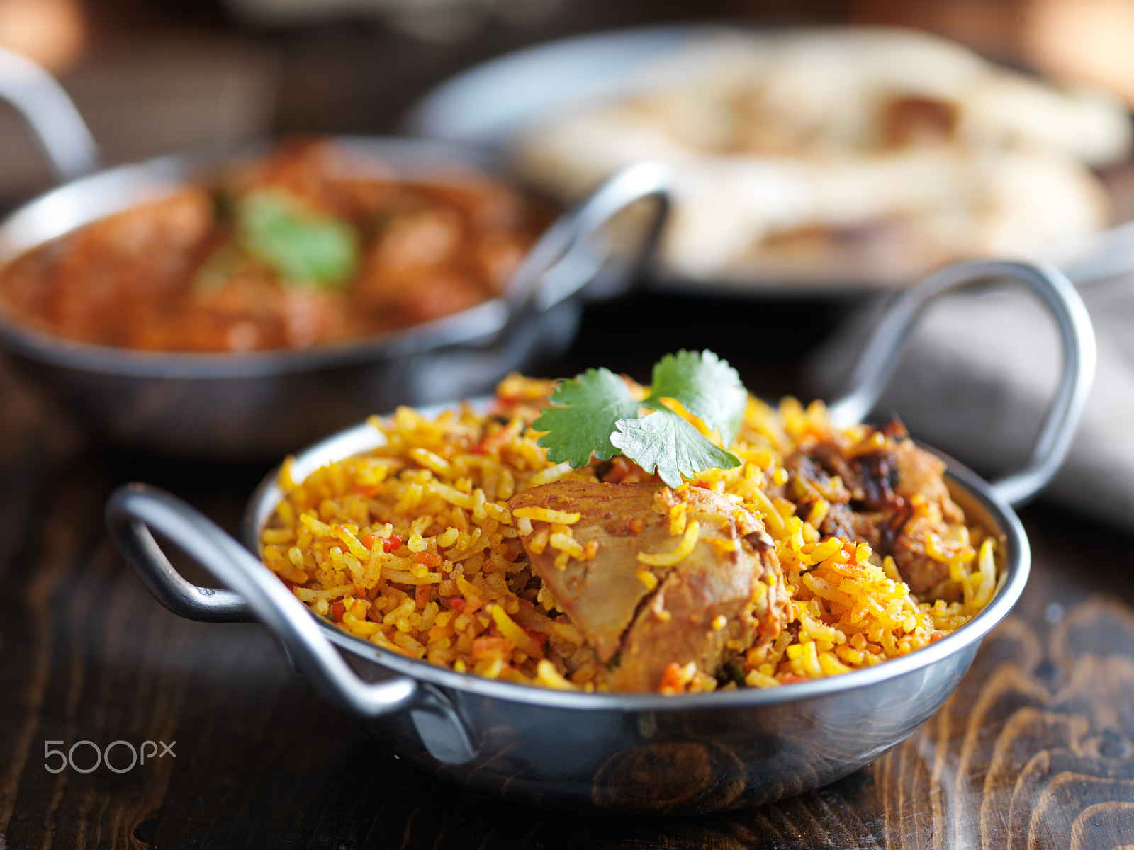 HC 120 sample photo. Balti dish with indian chicken biryani and curry in the background photography