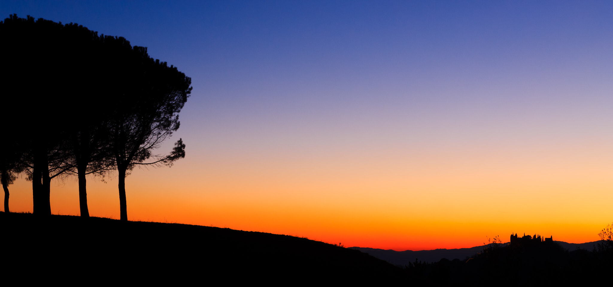 Canon EOS 1100D (EOS Rebel T3 / EOS Kiss X50) + Canon EF 17-40mm F4L USM sample photo. Hills panorama at sunset photography