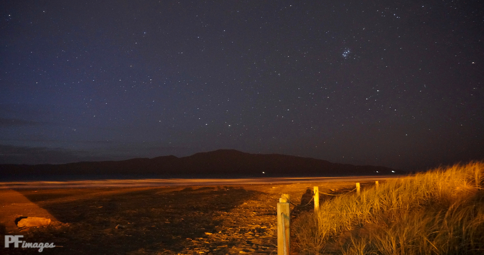 Sony Alpha NEX-5R + Sony E 18-50mm F4-5.6 sample photo. Paraparaumu beach at night photography