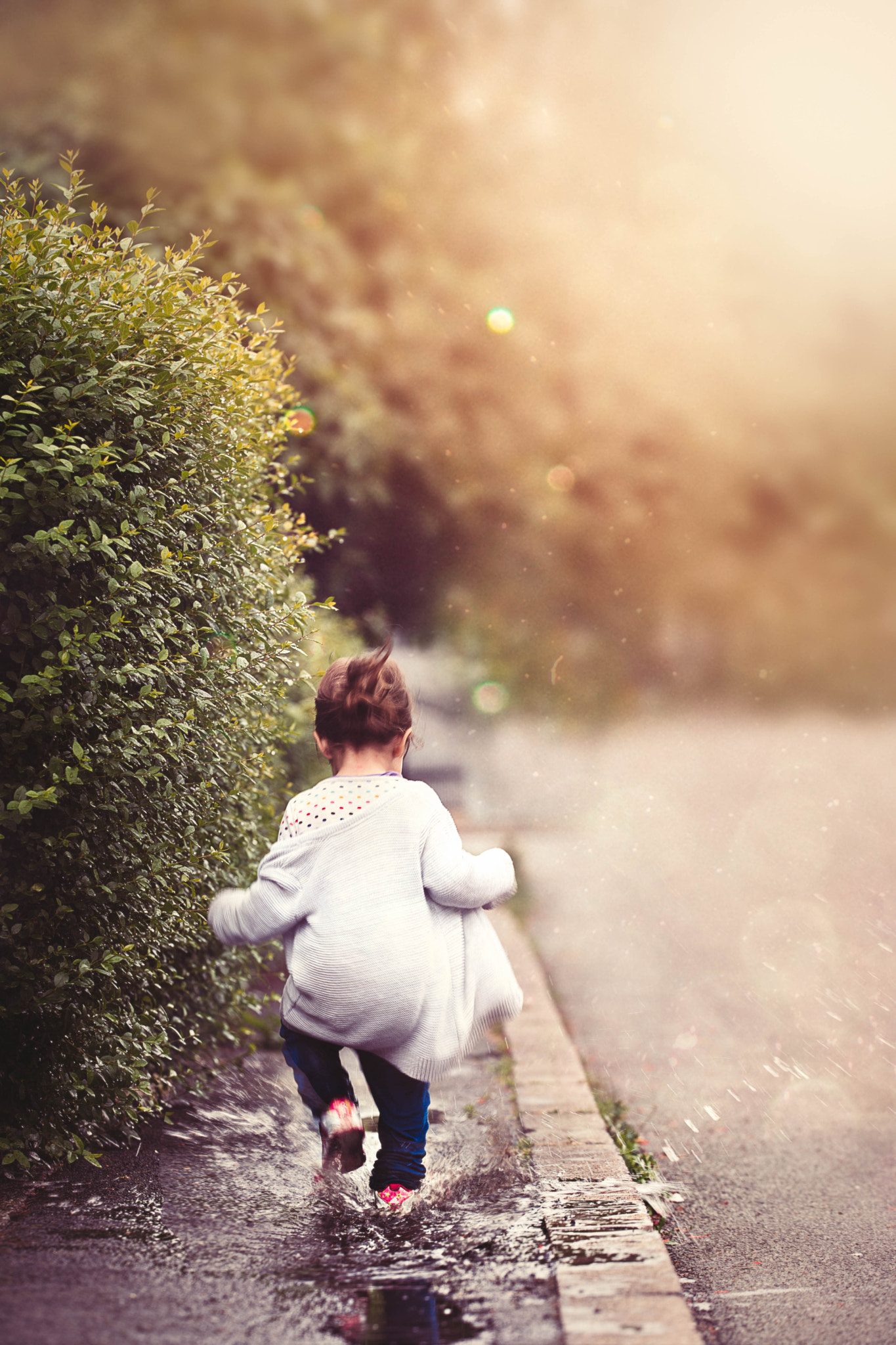 Sigma 150mm F2.8 EX DG OS Macro HSM sample photo. Kids need so little to be happy..puddle is enough photography