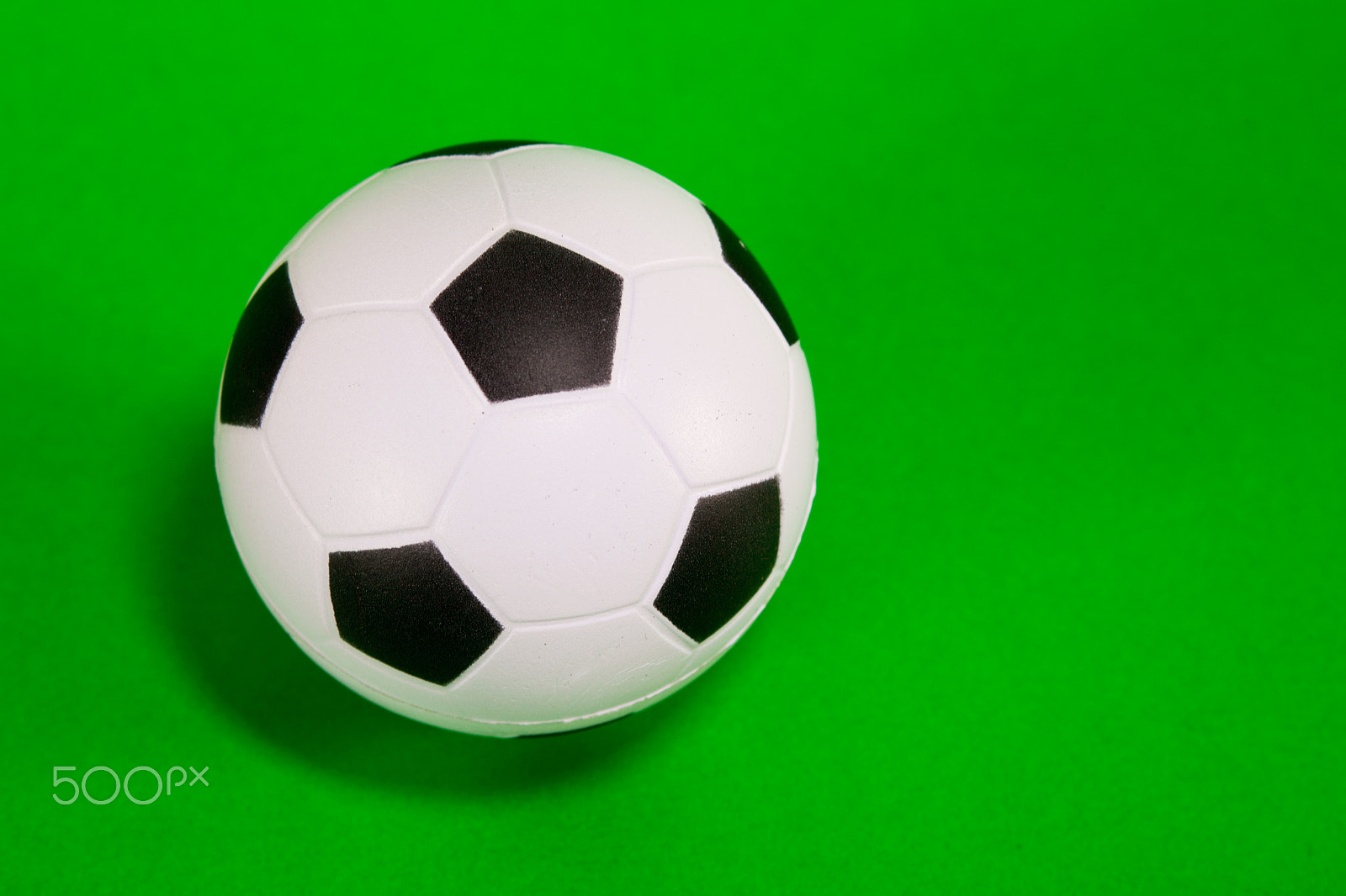 Canon EF 28-90mm f/4-5.6 sample photo. Small soccer ball over green background photography