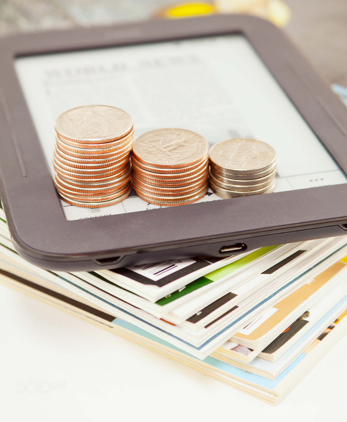 Canon EF 28-90mm f/4-5.6 sample photo. Electronic book reader with bars of coins photography