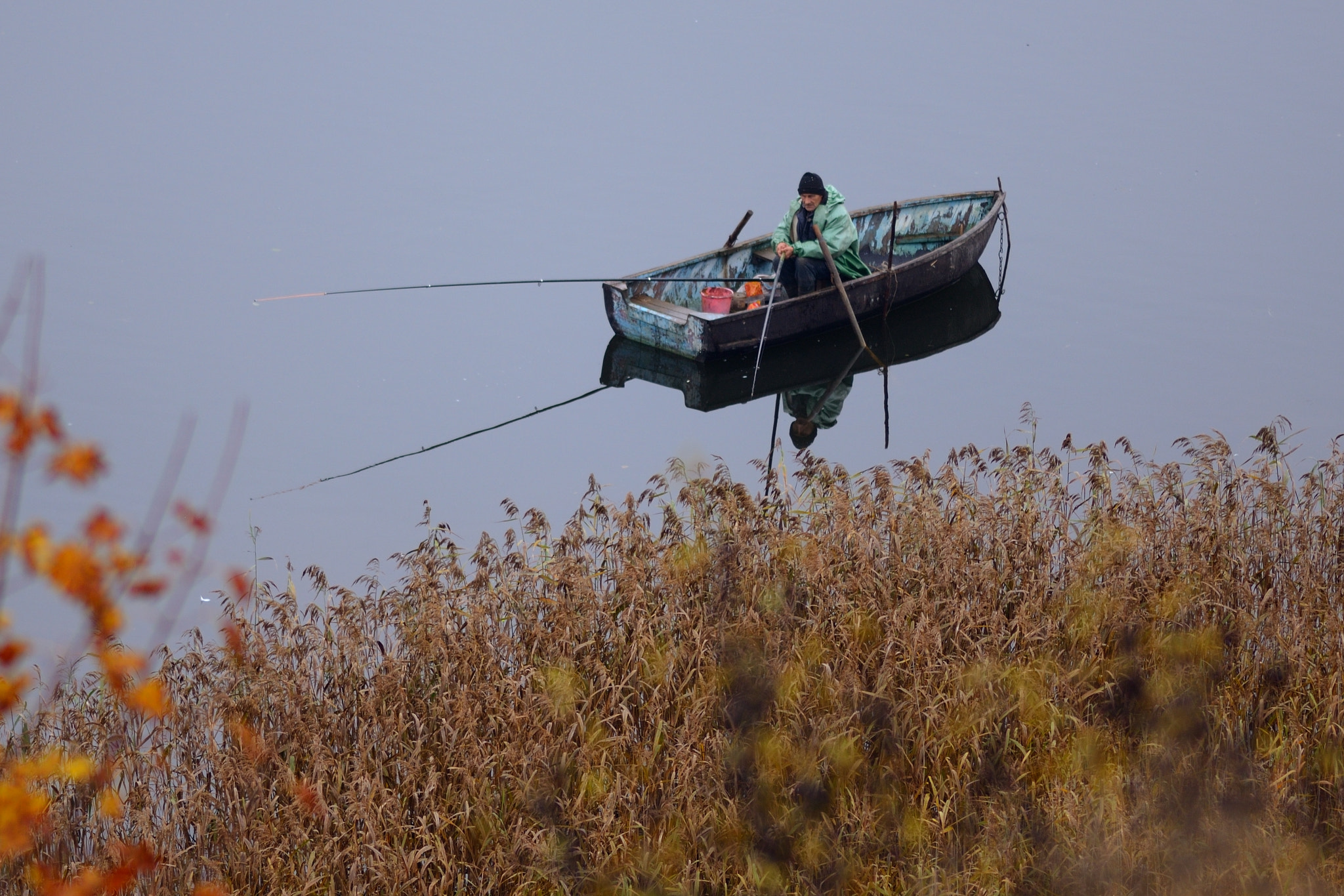 Nikon D600 + Nikon AF Nikkor 180mm F2.8D ED-IF sample photo. Fisherman casting his line photography