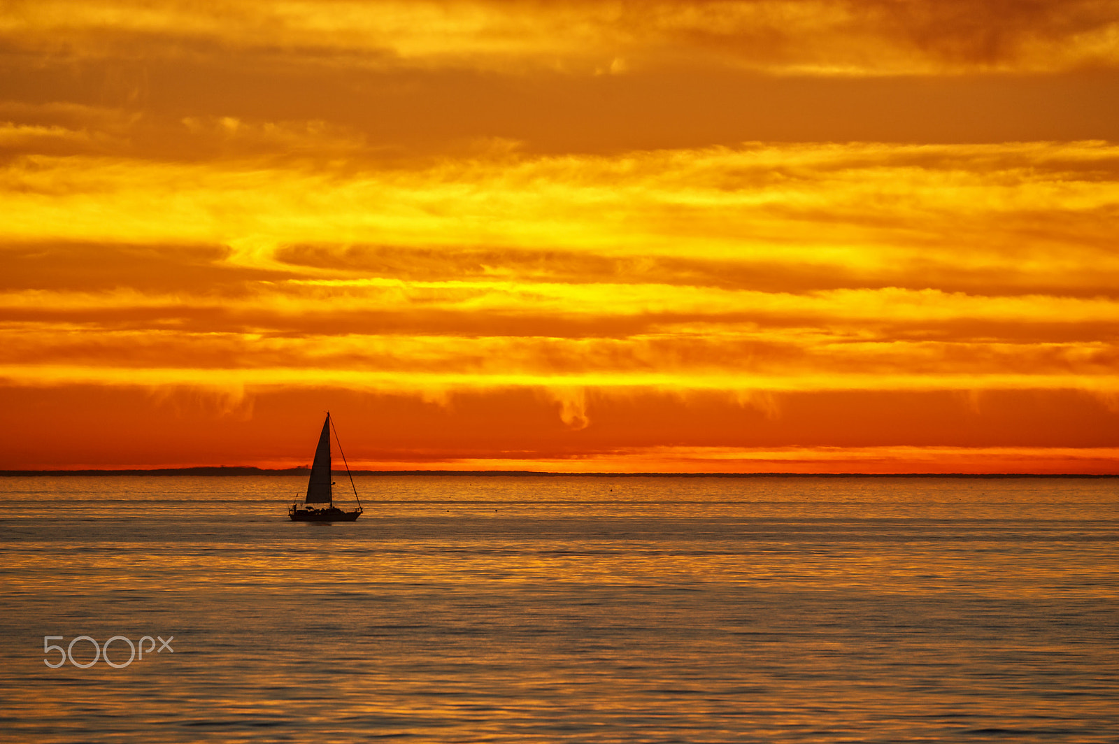 Nikon D3S sample photo. Fiery sunset and sailboat in oceanside photography
