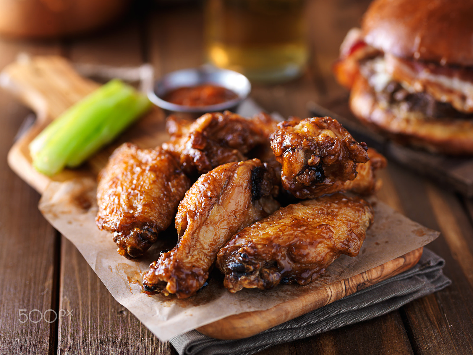 HC 120 sample photo. Crispy barbecue chicken wings with celery on wooden serving tray photography