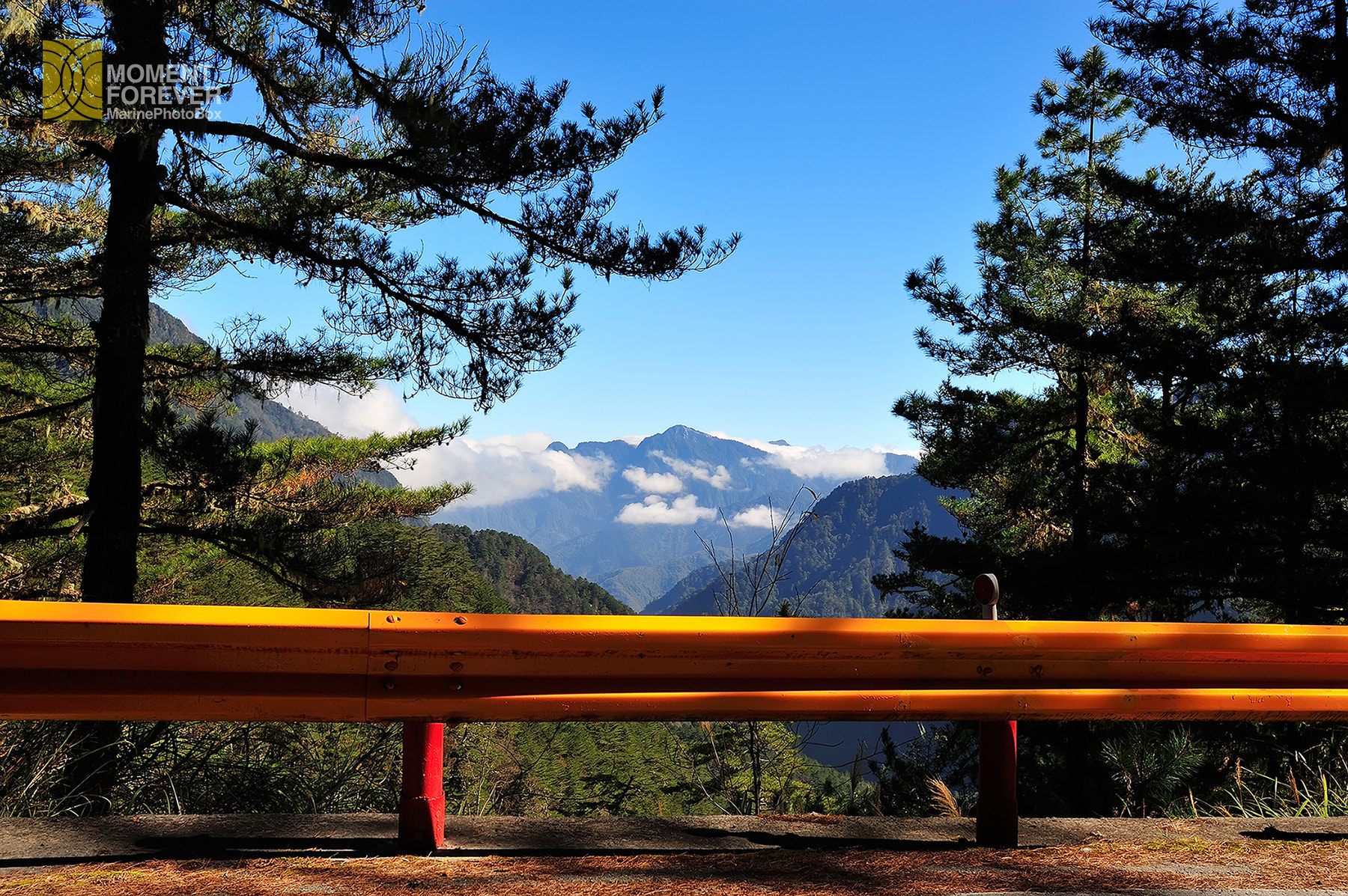 Nikon AF-S Nikkor 17-35mm F2.8D ED-IF sample photo. Yellow fence alone with a cloudy mountain photography