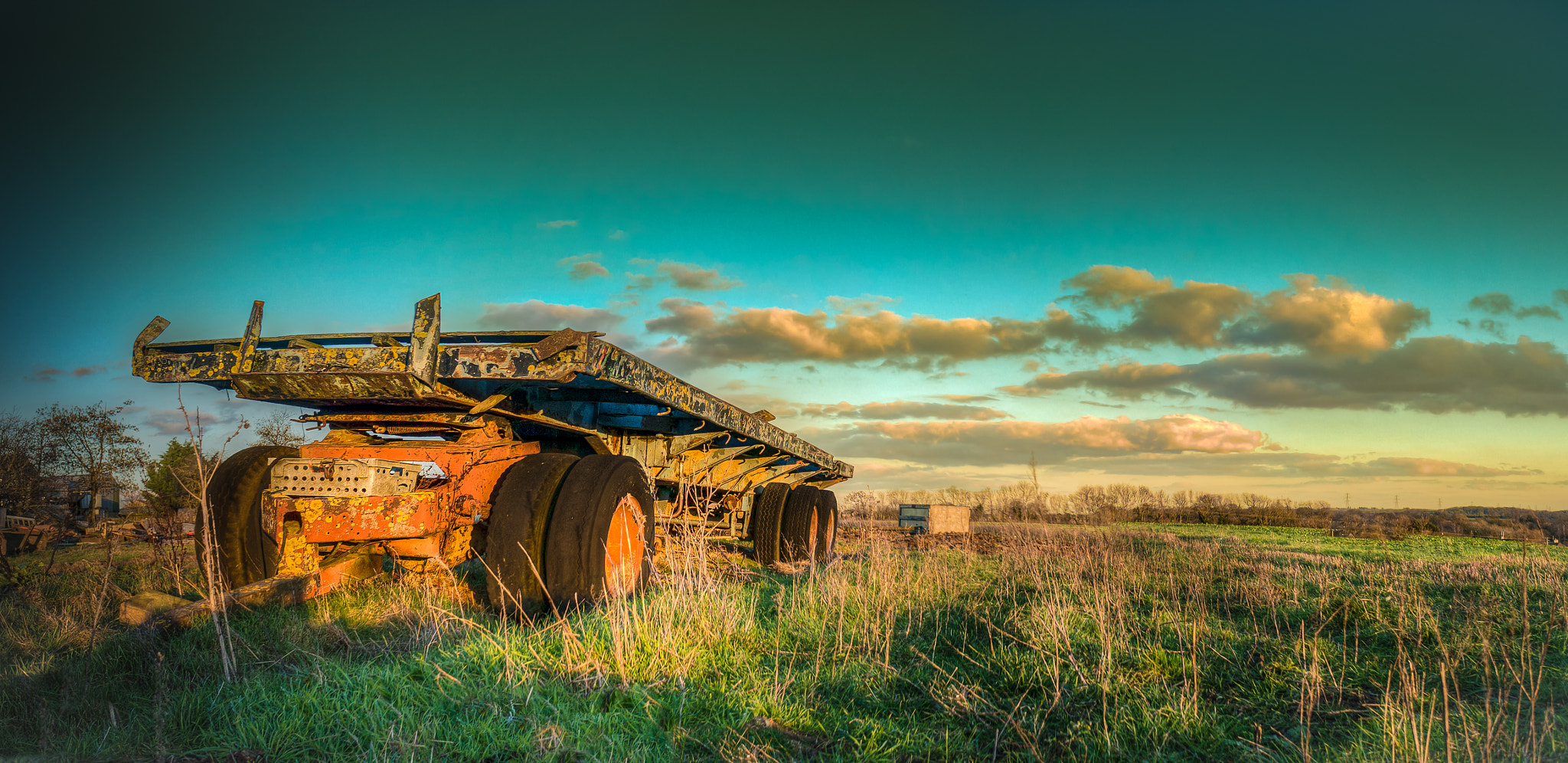 Sony Alpha NEX-5R + Sony E 16mm F2.8 sample photo. An old farm trailer photography